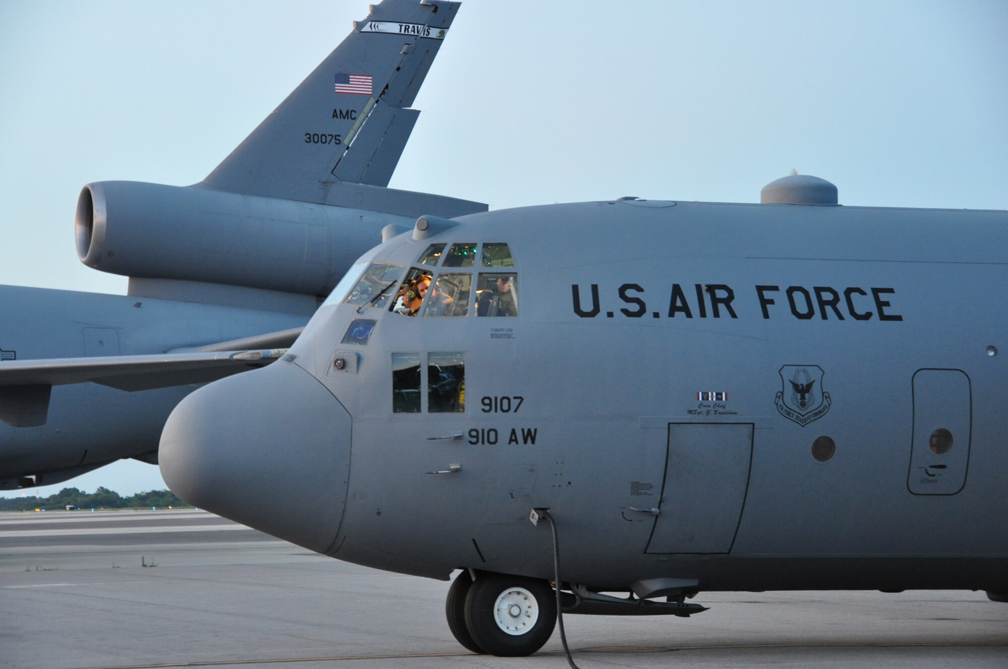 Joint Base Charleston – Air Base, S.C. -- Air Force Reserve Lt. Col. Eric Bishop, aircraft commander; Capt Steve Stroney, co-pilot and the rest of the flight crew of a C-130 Hercules tactical cargo aircraft, assigned to the 910th Airlift Wing, based at Youngstown Air Reserve Station, Ohio, conduct post-flight operations here, June 15, 2013. The aircraft and crew, part of the 910th’s Aerial Spray Unit, just concluded spray operations at the Joint Base’s Naval Weapons Station to control the population of the disease-carrying pest insects at the installation. The 910th’s 757th Airlift Squadron is home to the Department of Defense’s only large-area, fixed-wing aerial spray capability. U.S. Air Force photo by Master Sgt. Bob Barko Jr. 
