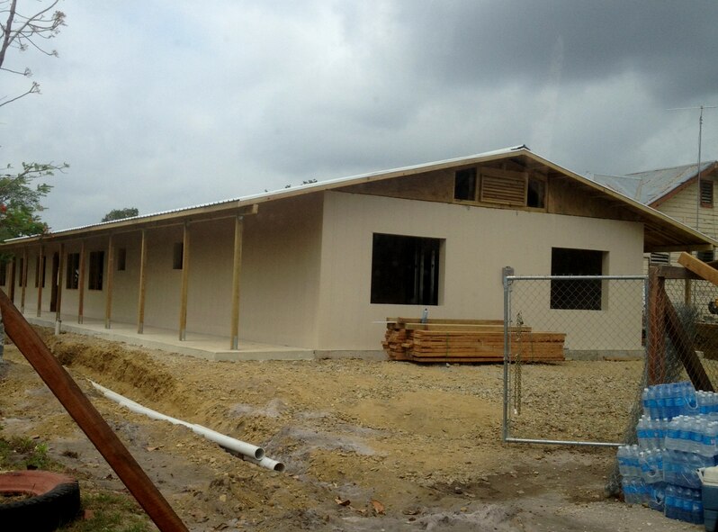 U.S. Air Force Staff Sgt. Donald King and Airman 1st Class Rhett Buttleman, both from the 7th Logistics Readiness Squadron, joined more than 90 Airmen from the 823rd RED HORSE Squadron to support Operation New Horizons in Belize. From March – May 2013, Buttleman and King took part in constructing schools, renovating outdated playground equipment and built new basketball courts. In total, the team built four schools, each accommodating up to 500 students. (Courtesy photo)