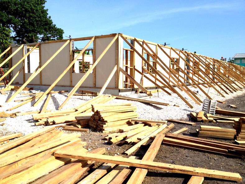 U.S. Air Force Staff Sgt. Donald King and Airman 1st Class Rhett Buttleman, both from the 7th Logistics Readiness Squadron, joined more than 90 Airmen from the 823rd RED HORSE Squadron to support Operation New Horizons in Belize. From March – May 2013, Buttleman and King took part in constructing schools, renovating outdated playground equipment and built new basketball courts. In total, the team built four schools, each accommodating up to 500 students. (Courtesy photo)