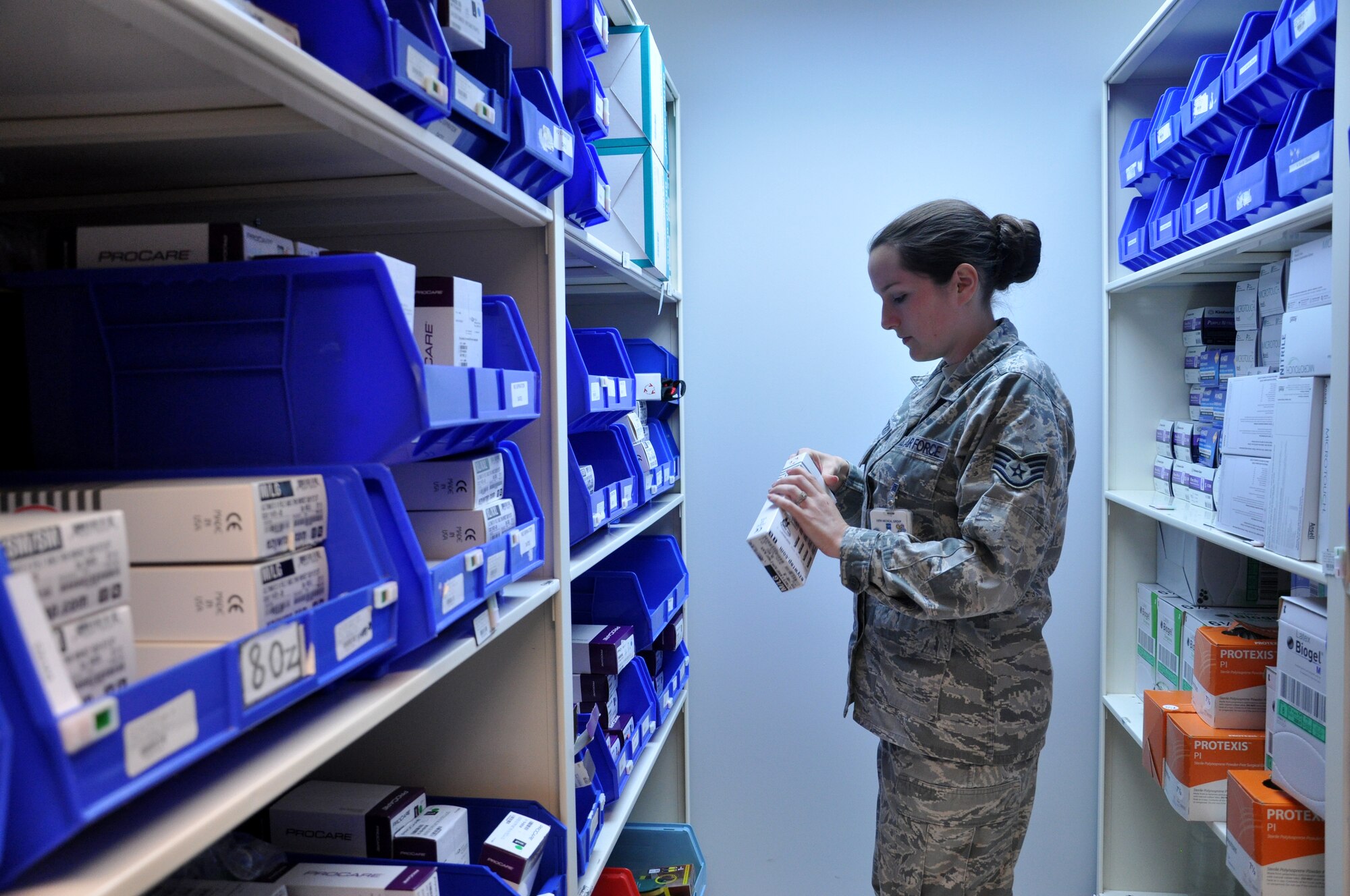 Staff Sgt. Amanda Tokarczk, 19th Medical Operations Squadron Family Health team lead, grabs supplies for casting a patient June 17, 2013, at Little Rock Air Force Base, Ark. Tokarczk, an Argonne, Wis., native,  stood-up more than 40 deployment clinics, ensuring 400 deployers were medically processed and cleared.  As one of the Family Health MiCARE leads, her team of five members personally registered 260 patients in just 35 days. (U.S. Air Force photo by Senior Airman Regina Agoha)