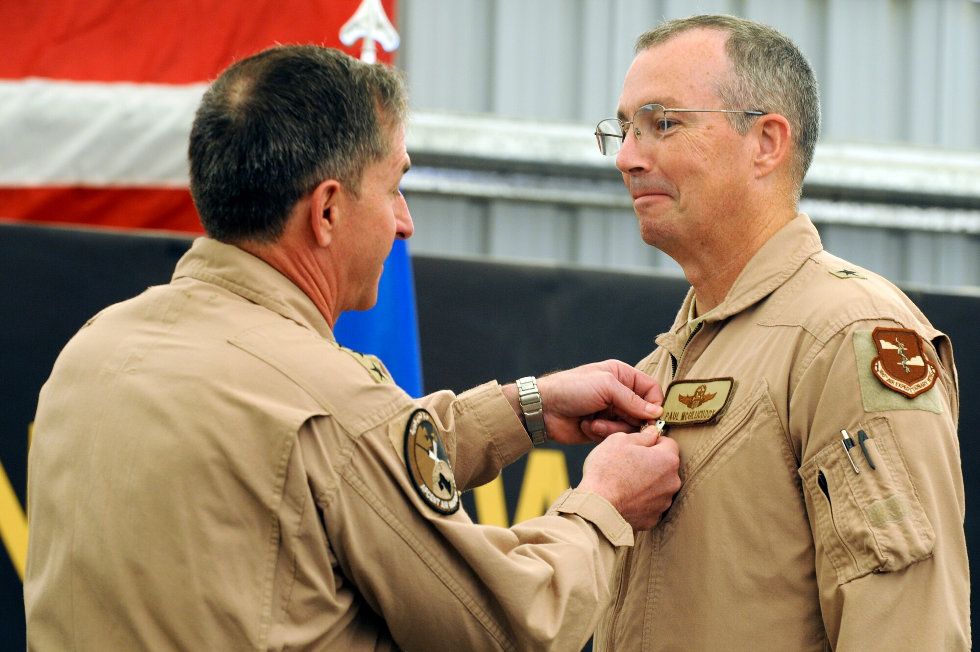 U.S Air Force Lt. Gen. David Goldfein, U.S. Air Forces Central commander, pins a Bronze Star medal onto U.S. Air Force Brig. Gen. Paul McGillicuddy, former 380th Air Expeditionary Wing commander, during the 380th AEW change of command ceremony at an undisclosed location in Southwest Asia June 20, 2013.  McGillicuddy led a wing comprised of five locations, three countries, two areas of responsibility, 13 weapon systems, five groups and 24 squadrons. (U.S. Air Force photo by Staff Sgt. Joshua J. Garcia) 
