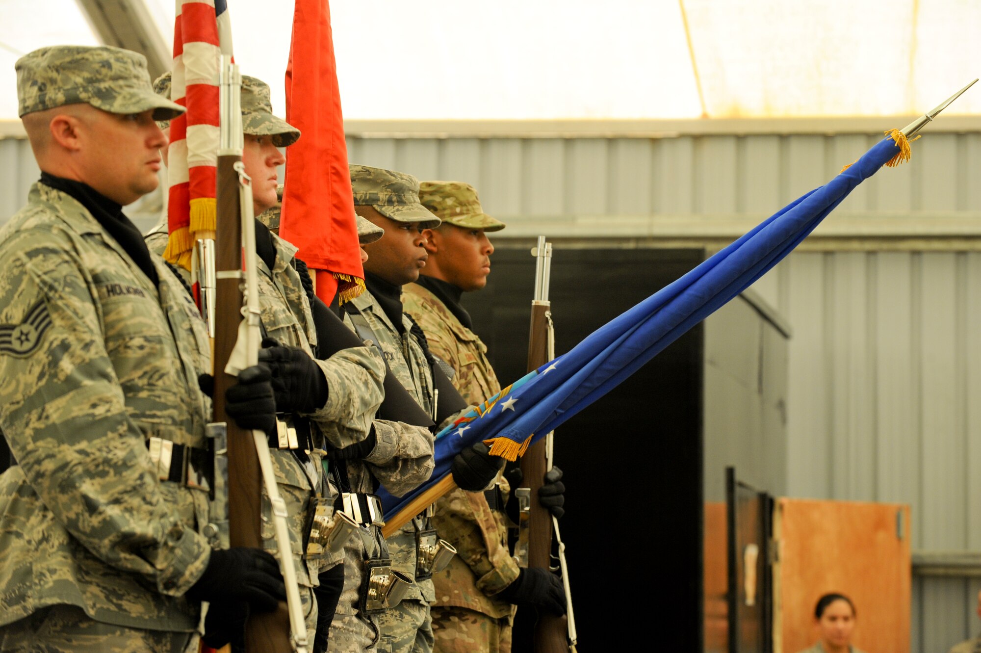 Members of the 380th Air Expeditionary Wing base honor guard, post the colors during the 380th AEW change of command ceremony at an undisclosed location in Southwest Asia June 20, 2013. U.S. Air Force Brig. Gen. Kevin Schneider took command of the wing during the ceremony. Schneider was selected by U.S Air Force Lt. Gen. David Goldfein, U.S. Air Forces Central commander, to lead the wing. (U.S. Air Force photo by Staff Sgt. Joshua J. Garcia) 