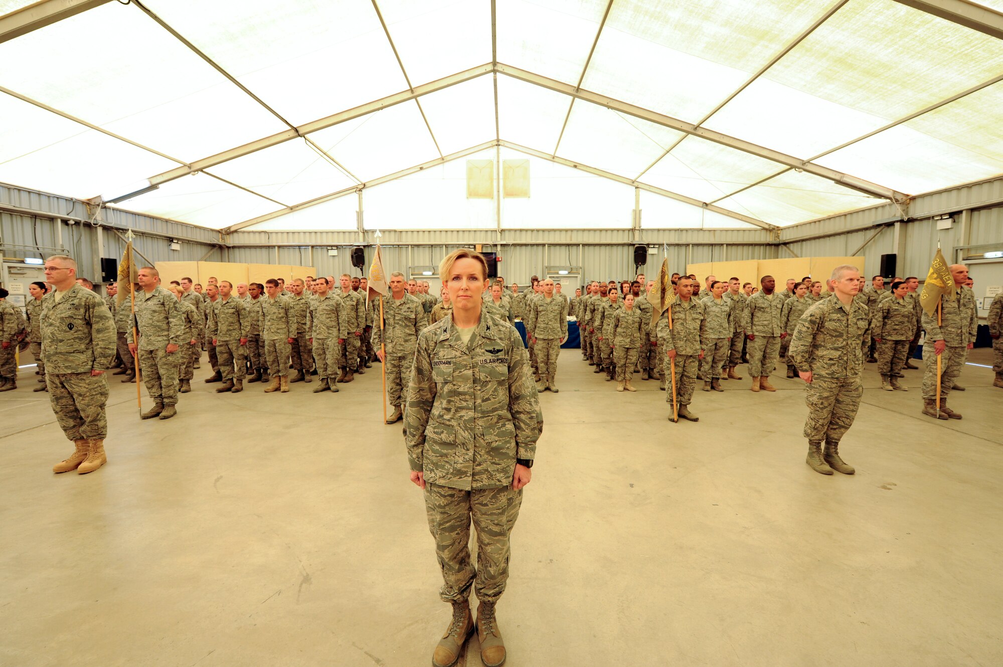 U.S. Air Force Col. Laura Lenderman, 380th Air Expeditionary Wing vice commander, stands as commander  380th AEW’s formation during the wing change of command ceremony at an undisclosed location in Southwest Asia June 20, 2013.  During the ceremony U.S. Air Force Brig. Gen. Kevin Schneider took command of the wing from U.S. Air Force Brig. Gen. Paul McGillicuddy. (U.S. Air Force photo by Staff Sgt. Joshua J. Garcia) 