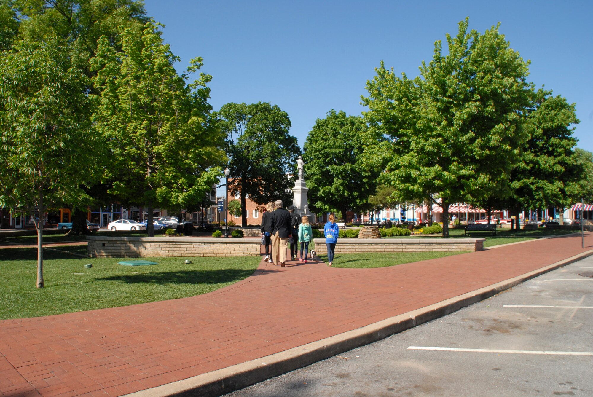 Families take a Sunday-afternoon stroll in the townsquare May 12, 2013, in Bentonville, Ark. Bentonville is approximately a three and a half hour drive from Little Rock Air Force Base, considerd within the “local area” for travelling to on off-duty time. (U.S. Air Force photo by Staff Sgt. Jake Barreiro)