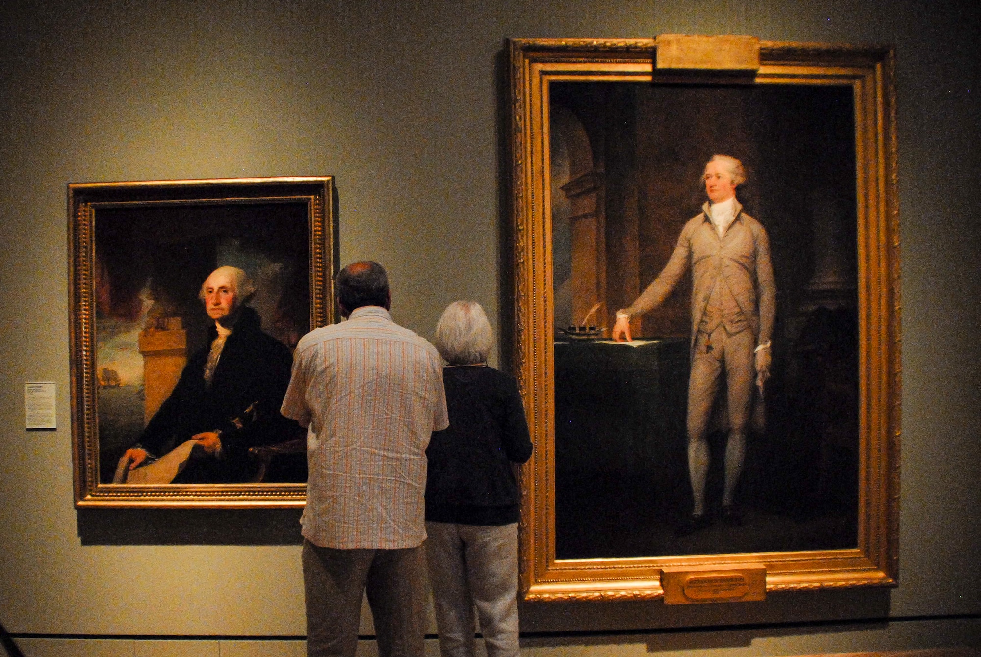 A couple peruses portraits of George Washing in the Crystal Bridges Museum of American Arts May 12, 2013, in Bentonville, Ark. The left portrait of Washington is one of the more famous renderings of America’s first President,and one of many colonial-era artworks on display at the museum. (U.S. Air Force photo by Staff Sgt. Jake Barreiro)
