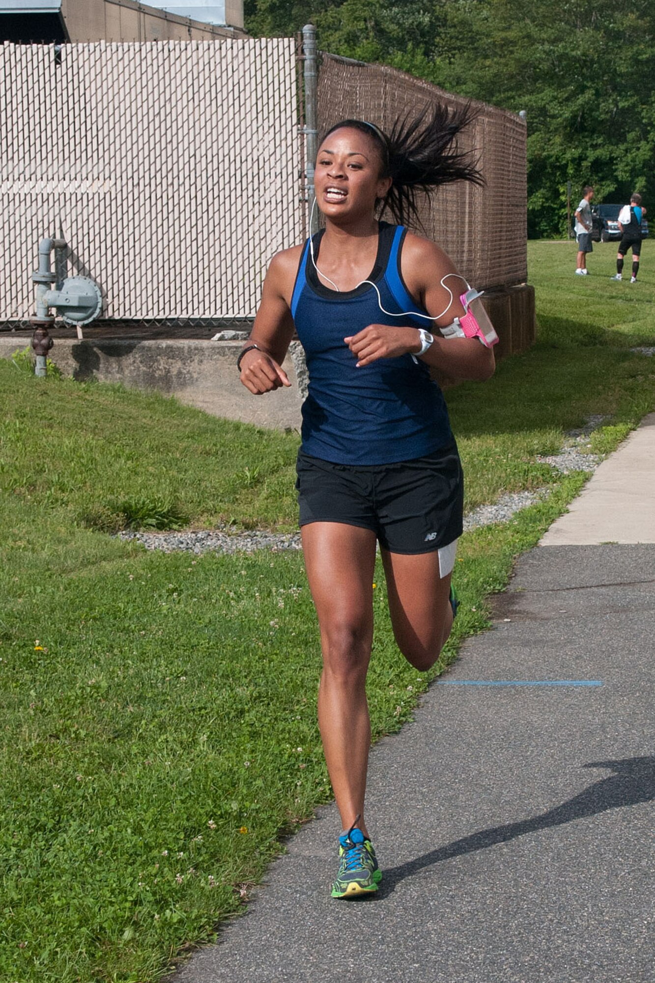 HANSCOM AIR FORCE BASE, Mass. – First Lt. Jade Best approaches the finish line at the Summer Thunder 10K race that began and finished outside the Hanscom Sports and Fitness Center June 19. The top three male finishers were John Mackovjak, 38:20; Capt. Scott Dotto, 38:34; James Mackovjak, 39:14. The top three females finishers were Ann-Marie Ely, 53:36; 1st Lt. Jade Best, 55:09; Taylor DeLaPena, 58:21. (U.S. Air Force photo by Rick Berry)