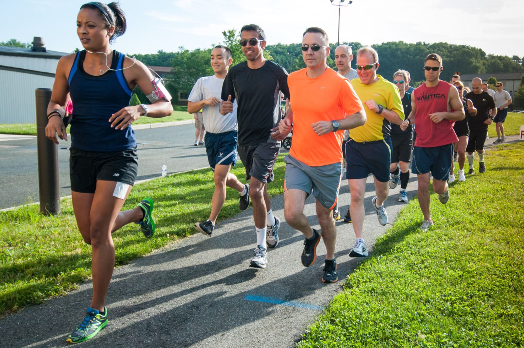 HANSCOM AIR FORCE BASE, Mass. – Runners take off at the start of Summer Thunder, a 10K road race that began and finished outside the Hanscom Sports and Fitness Center June 19. The top three male finishers were John Mackovjak, 38:20; Capt. Scott Dotto, 38:34; James Mackovjak, 39:14. The top three females finishers were Ann-Marie Ely, 53:36; 1st Lt. Jade Best, 55:09; Taylor DeLaPena, 58:21. (U.S. Air Force photo by Rick Berry)
