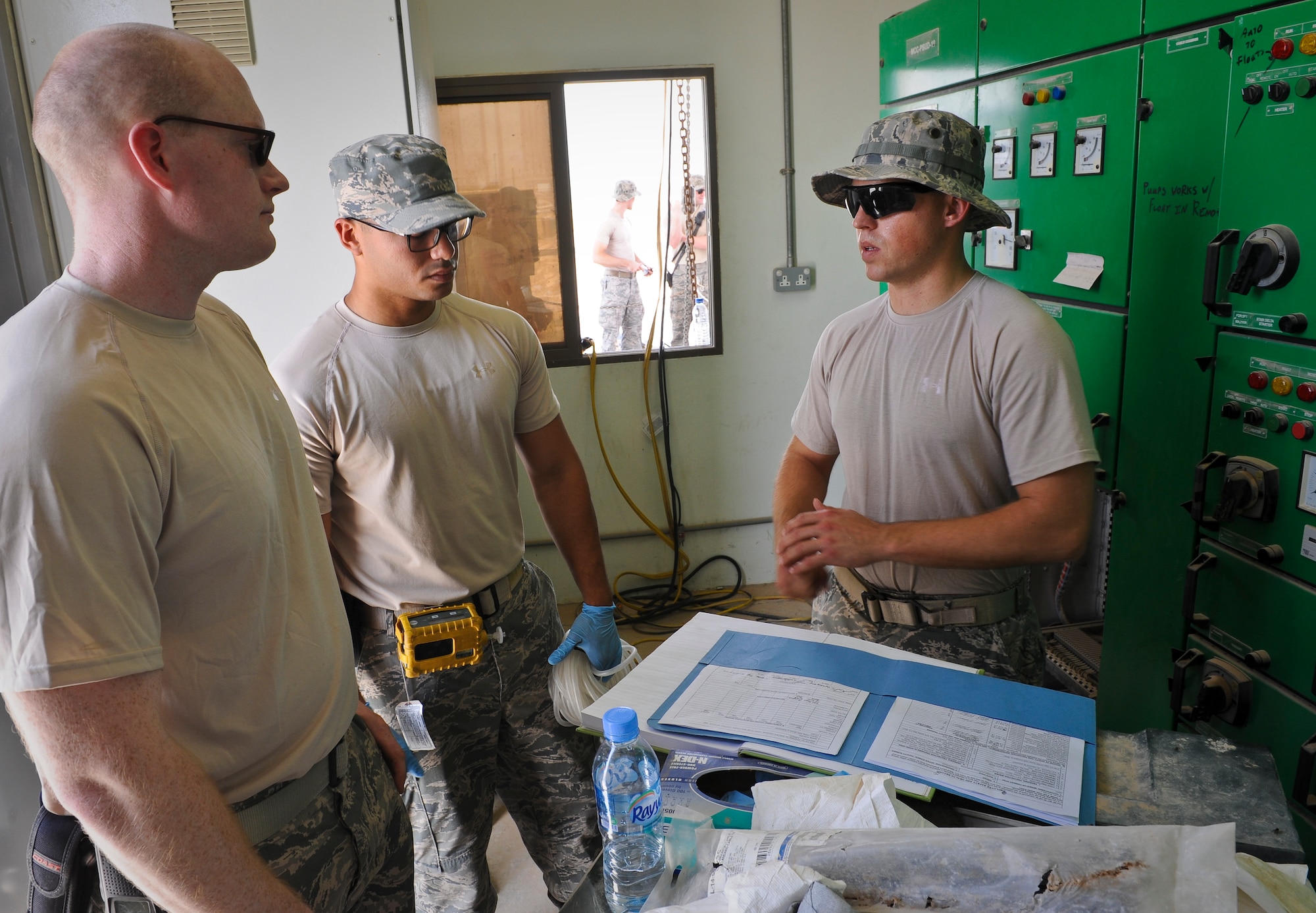 Tech. Sgt. David Almy talks with civil engineer Airmen about the importance of maintaining a safe working environment by following the rules and procedures outlined in safety instructions at the 379th Air Expeditionary Wing in Southwest Asia, June 18, 2013. Almy is a 379th AEW ground safety technician deployed from McConnell Air Force Base, Kan. (U.S. Air Force photo/Senior Airman Benjamin Stratton)