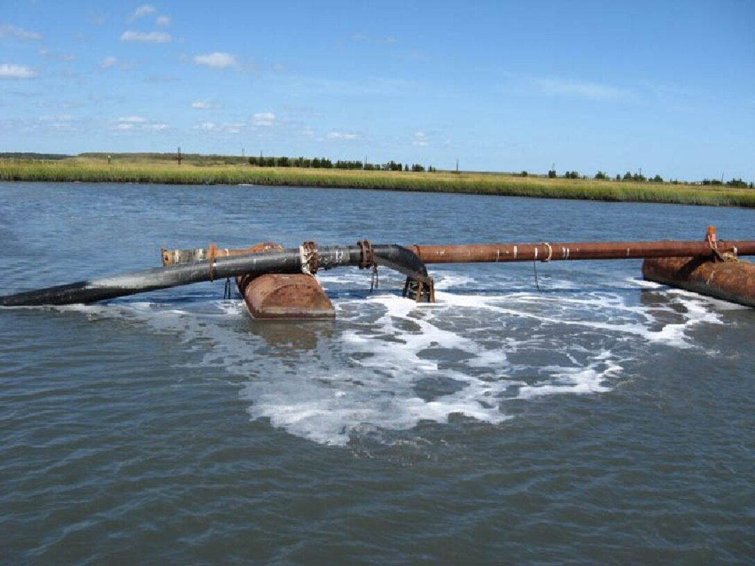 Dredging operations at the restoration project site from the Fall of 2010. The Dredged Hole 35 Restoration Project involves filling the existing dredged hole with approximately 118,000 cubic yards of dredged material from NJIWW maintenance dredging to restore approximately 4 acres of submerged aquatic vegetation and fisheries habitat.