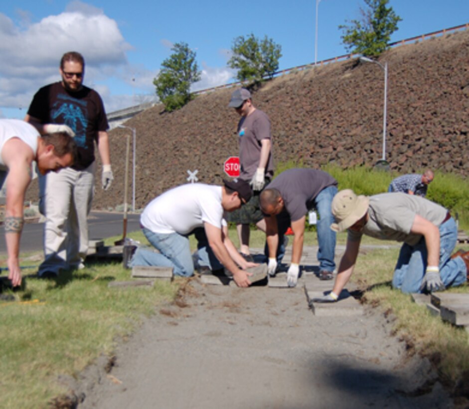 On June 12, 42 volunteers from Google worked on service projects at The Dalles Dam Visitor Center, Seufert Park and Patterson Park. The Googlers provided a total of 129 hours of labor, yielding more than $2,856 in savings to the U.S. Army Corps of Engineers. Park rangers and volunteers worked on painting guardrails and signposts; improving trails, draining Patterson Pond and scooping silt out; removing brush and debris; planting 37 native plants around the visitor center; and trimming and pulling weeds. Their hard work helped to beautify our parks, and allowed us to catch up on a backlog of maintenance items. Thank you, volunteers!
