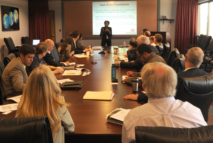 Contract Specialist Geordelle Charles (center, standing) explains procedures Huntsville Center will follow once a task order is awarded using geothermal technology under the Renewable and Alternative Energy Power Production for DoD Installations contract. Charles and other Center officials spent the day June 20 meeting with representatives from companies awarded contracts for use in competing and awarding power purchase agreement geothermal technology task orders. The companies are Constellation NewEnergy, Inc., Baltimore, Md.; ECC Renewables, LLC, – Burlingame, Calif.; Enel Green Power North America, Inc. – Andover, Mass.; LTC Federal, LLC, Detroit, Mich.; and Siemens Government Technologies, Inc., Arlington, Va. Announcement of awards for the remaining technologies, solar, wind and biomass, are anticipated for staggered release through the end of calendar year 2013.