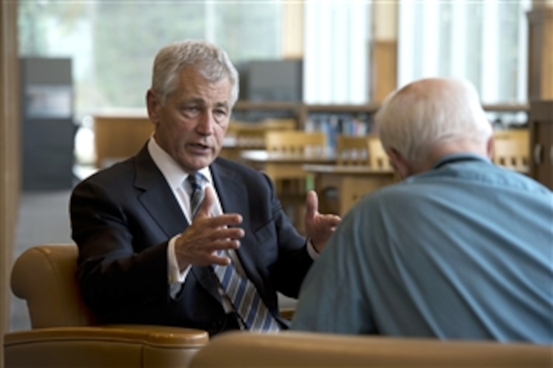 Secretary of Defense Chuck Hagel answers a question during an interview with Lincoln Star Journal reporter Don Walton at the University of Nebraska Omaha, Neb., on June 19, 2013.  Hagel earlier held a moderated discussion with university students and faculty at the Strauss Performing Arts Center.  