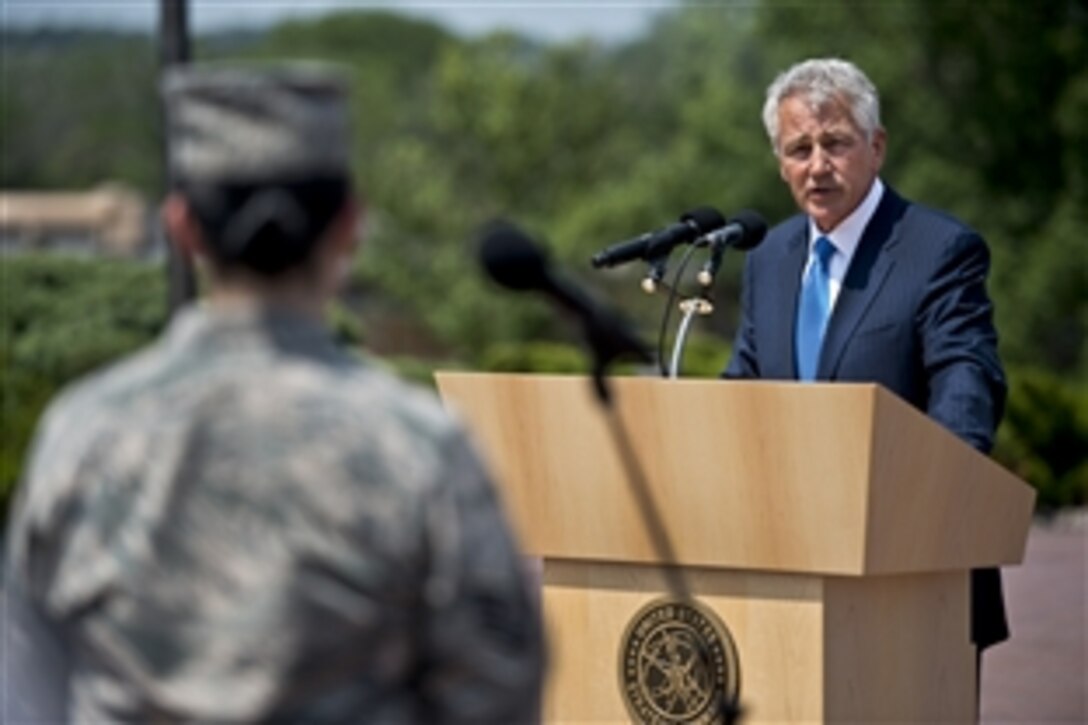 Defense Secretary Chuck Hagel answers an airman's question on Offutt Air Force Base, Neb., June 20, 2013. Hagel met with senior leaders, received command briefings, and visited with troops and civilians to thank them for their service.