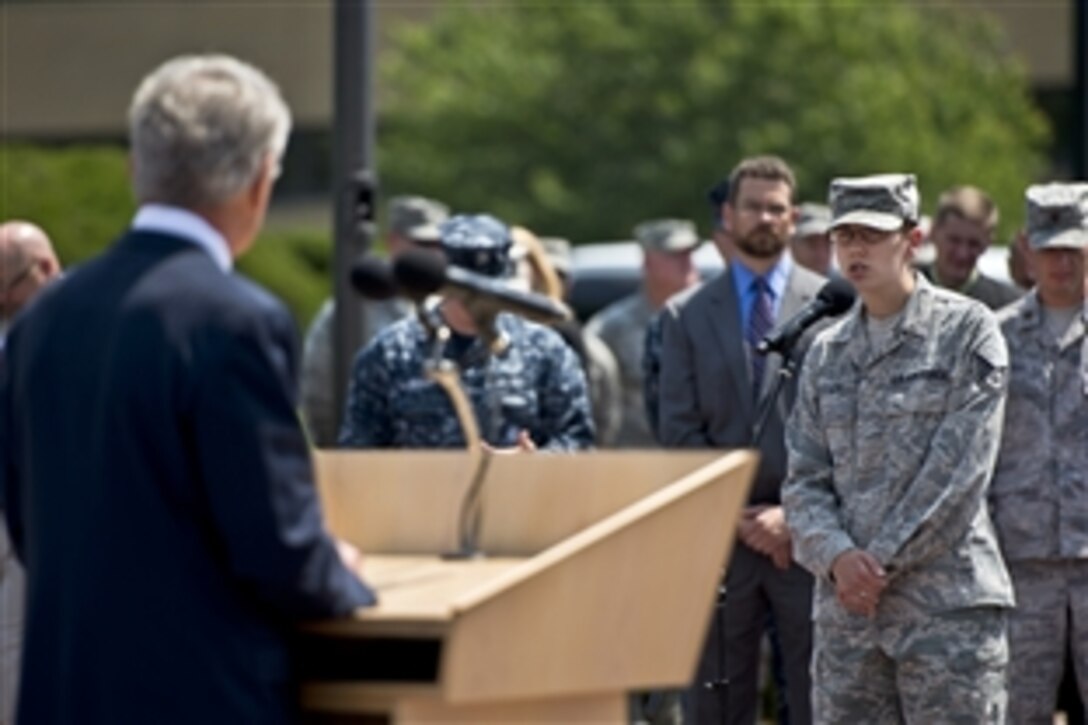 Defense Secretary Chuck Hagel listens to an airman's question on Offutt Air Force Base, Neb., June 20, 2013. Hagel met with senior leaders, received command briefings, and visited with troops and civilians to thank them for their service.