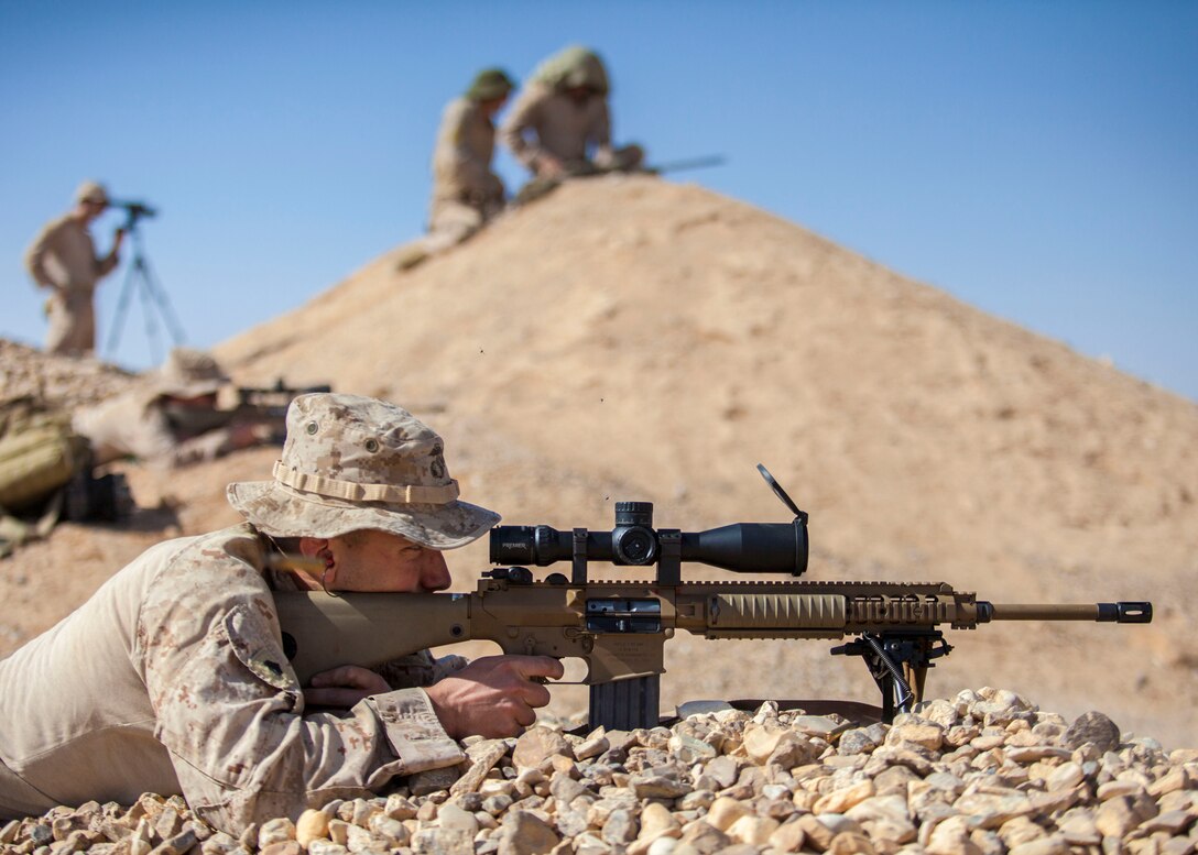 A 26th Marine Expeditionary Unit (MEU) Maritime Raid Force Marine engages a long distance target with an M110 Semi-Automatic Sniper System at a range in Jordan, June 10, 2013. Exercise Eager Lion 2013 is an annual, multinational exercise designed to strengthen military-to-military relationships and enhance security and stability in the region by responding to modern-day security scenarios. The 26th MEU is a Marine Air-Ground Task Force forward-deployed to the U.S. 5th Fleet area of responsibility aboard the Kearsarge Amphibious Ready Group serving as a sea-based, expeditionary crisis response force capable of conducting amphibious operations across the full range of military operations. (U.S. Marine Corps photograph by Sgt. Christopher Q. Stone, 26th MEU Combat Camera/Released)