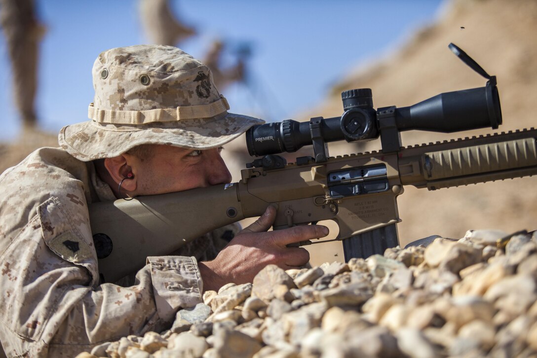 A 26th Marine Expeditionary Unit (MEU) Maritime Raid Force Marine engages a long distance target with an M110 Semi-Automatic Sniper System at a range in Jordan, June 10, 2013. Exercise Eager Lion 2013 is an annual, multinational exercise designed to strengthen military-to-military relationships and enhance security and stability in the region by responding to modern-day security scenarios. The 26th MEU is a Marine Air-Ground Task Force forward-deployed to the U.S. 5th Fleet area of responsibility aboard the Kearsarge Amphibious Ready Group serving as a sea-based, expeditionary crisis response force capable of conducting amphibious operations across the full range of military operations. (U.S. Marine Corps photograph by Sgt. Christopher Q. Stone, 26th MEU Combat Camera/Released)