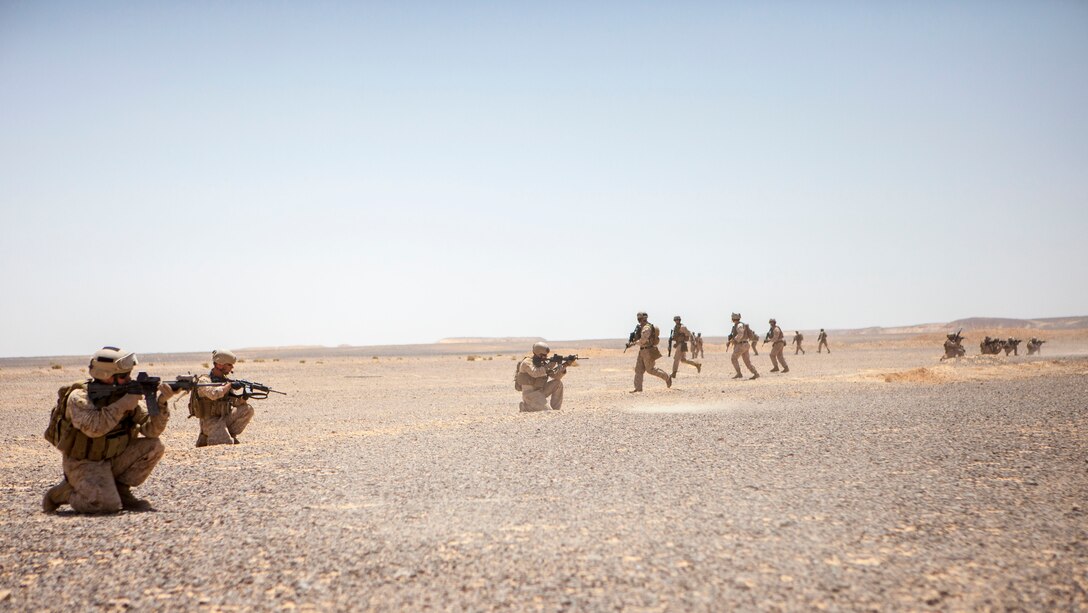 26th Marine Expeditionary Unit (MEU) Maritime Raid Force Marines engage simulated hostile targets as teams break contact and bound back during an immediate action drill exercise at a range in Jordan, June 13, 2013. Exercise Eager Lion 2013 is an annual, multinational exercise designed to strengthen military-to-military relationships and enhance security and stability in the region by responding to modern-day security scenarios. The 26th MEU is a Marine Air-Ground Task Force forward-deployed to the U.S. 5th Fleet area of responsibility aboard the Kearsarge Amphibious Ready Group serving as a sea-based, expeditionary crisis response force capable of conducting amphibious operations across the full range of military operations. (U.S. Marine Corps photograph by Sgt. Christopher Q. Stone, 26th MEU Combat Camera/Released)