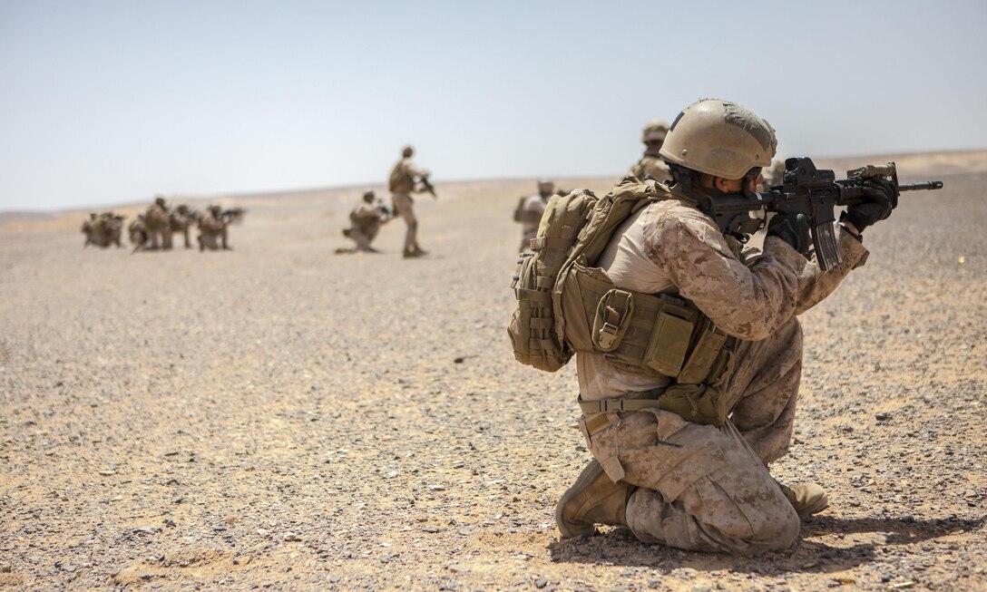 26th Marine Expeditionary Unit (MEU) Maritime Raid Force Marines engage simulated hostile targets during an immediate action drill exercise at a range in Jordan, June 13, 2013. Exercise Eager Lion 2013 is an annual, multinational exercise designed to strengthen military-to-military relationships and enhance security and stability in the region by responding to modern-day security scenarios. The 26th MEU is a Marine Air-Ground Task Force forward-deployed to the U.S. 5th Fleet area of responsibility aboard the Kearsarge Amphibious Ready Group serving as a sea-based, expeditionary crisis response force capable of conducting amphibious operations across the full range of military operations. (U.S. Marine Corps photograph by Sgt. Christopher Q. Stone, 26th MEU Combat Camera/Released)