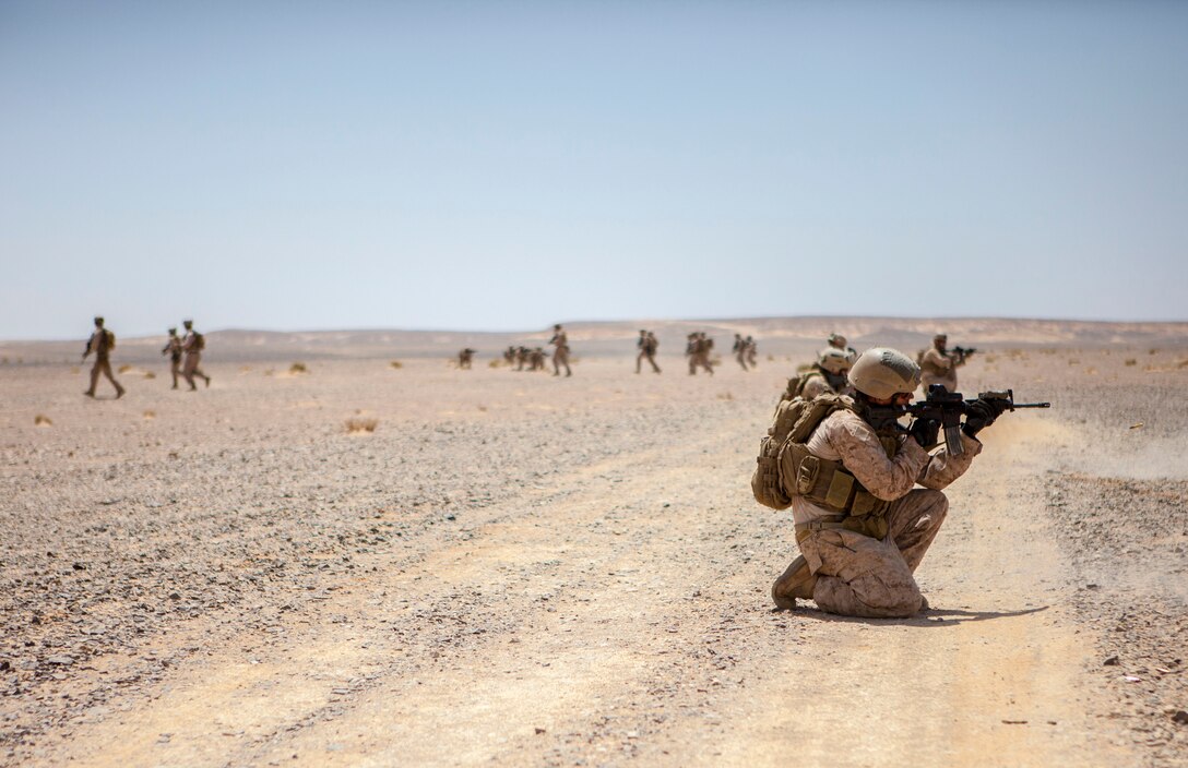 26th Marine Expeditionary Unit (MEU) Maritime Raid Force Marines engage simulated hostile targets as teams break contact and bound back during an immediate action drill exercise at a range in Jordan, June 13, 2013. Exercise Eager Lion 2013 is an annual, multinational exercise designed to strengthen military-to-military relationships and enhance security and stability in the region by responding to modern-day security scenarios. The 26th MEU is a Marine Air-Ground Task Force forward-deployed to the U.S. 5th Fleet area of responsibility aboard the Kearsarge Amphibious Ready Group serving as a sea-based, expeditionary crisis response force capable of conducting amphibious operations across the full range of military operations. (U.S. Marine Corps photograph by Sgt. Christopher Q. Stone, 26th MEU Combat Camera/Released)