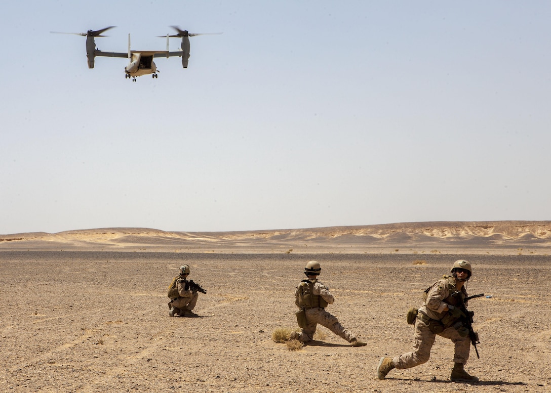 An MV-22B Osprey assigned to Marine Medium Tiltrotor Squadron (VMM) 266 (Reinforced), 26th Marine Expeditionary Unit (MEU), prepares to land to extract the MEU's Maritime Raid Force Marines during immediate action drill exercise at a range in Jordan, June 13, 2013. Exercise Eager Lion 2013 is an annual, multinational exercise designed to strengthen military-to-military relationships and enhance security and stability in the region by responding to modern-day security scenarios. The 26th MEU is a Marine Air-Ground Task Force forward-deployed to the U.S. 5th Fleet area of responsibility aboard the Kearsarge Amphibious Ready Group serving as a sea-based, expeditionary crisis response force capable of conducting amphibious operations across the full range of military operations. (U.S. Marine Corps photograph by Sgt. Christopher Q. Stone, 26th MEU Combat Camera/Released)