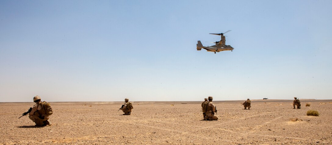 An MV-22B Osprey assigned to Marine Medium Tiltrotor Squadron (VMM) 266 (Reinforced), 26th Marine Expeditionary Unit (MEU), prepares to land to extract the MEU's Maritime Raid Force Marines during immediate action drill exercise at a range in Jordan, June 13, 2013. Exercise Eager Lion 2013 is an annual, multinational exercise designed to strengthen military-to-military relationships and enhance security and stability in the region by responding to modern-day security scenarios. The 26th MEU is a Marine Air-Ground Task Force forward-deployed to the U.S. 5th Fleet area of responsibility aboard the Kearsarge Amphibious Ready Group serving as a sea-based, expeditionary crisis response force capable of conducting amphibious operations across the full range of military operations. (U.S. Marine Corps photograph by Sgt. Christopher Q. Stone, 26th MEU Combat Camera/Released)