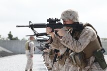 Lance Cpl. Matthew C. Meid practices sighting in with an unloaded M16A4 service rifle June 13 at Camp Hansen before qualifying in intermediate combat rifle marksmanship. The Marines also qualified with the shotgun, M67 fragmentation grenade, and M9 service pistol, and completed intermediate combat rifle marksmanship training with the M16A4 service rifle. Meid is a data network specialist with 3rd Marine Logistics Group Headquarters, 3rd MLG, III Marine Expeditionary Force. (Marine Corps photo by Lance Cpl. Anne K. Henry/Released)