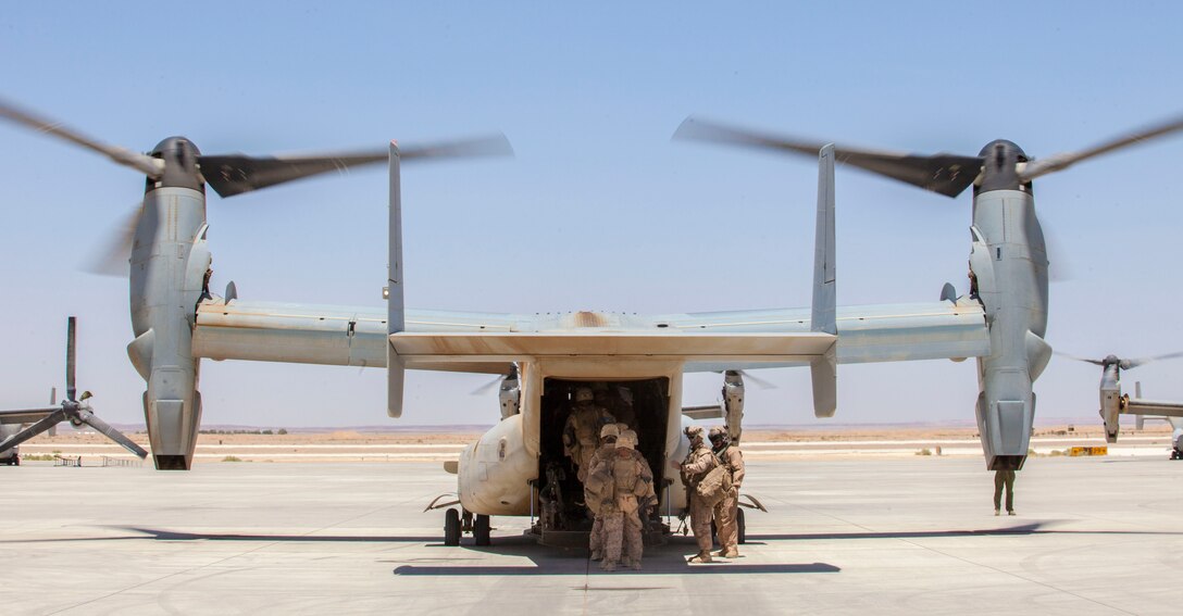 U.S. Marines assigned to Company I, Battalion Landing Team (BLT) 3/2, 26th Marine Expeditionary Unit, board an MV-22B Osprey assigned to Marine Medium Tiltrotor Squadron (VMM) 266 (Reinforced), at King Faisal Air Base in Jordan, June 14, 2013. Exercise Eager Lion 2013 is an annual, multinational exercise designed to strengthen military-to-military relationships and enhance security and stability in the region by responding to modern-day security scenarios. The 26th MEU is a Marine Air-Ground Task Force forward-deployed to the U.S. 5th Fleet area of responsibility aboard the Kearsarge Amphibious Ready Group serving as a sea-based, expeditionary crisis response force capable of conducting amphibious operations across the full range of military operations. (U.S. Marine Corps photograph by Sgt. Christopher Q. Stone, 26th MEU Combat Camera/Released)