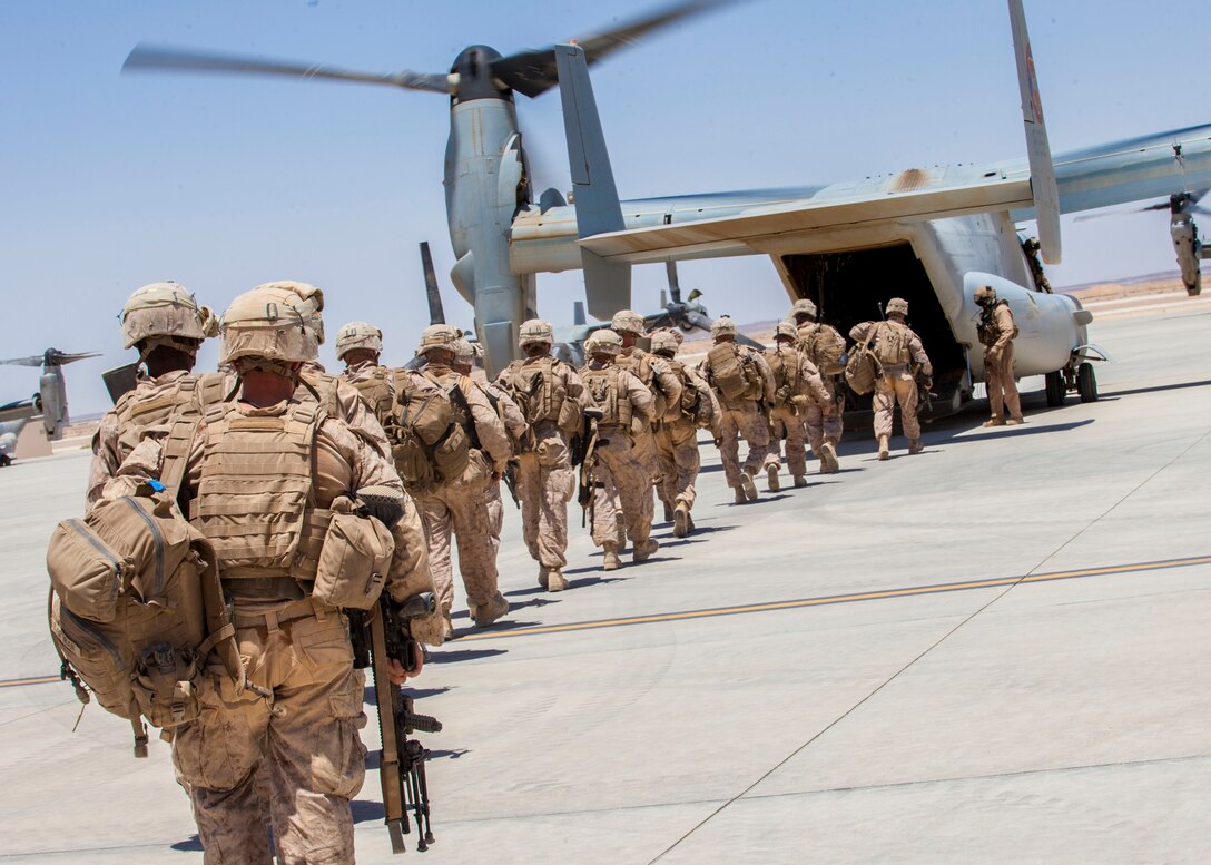 U.S. Marines assigned to Company I, Battalion Landing Team (BLT) 3/2, 26th Marine Expeditionary Unit, board an MV-22B Osprey assigned to Marine Medium Tiltrotor Squadron (VMM) 266 (Reinforced), at King Faisal Air Base in Jordan, June 14, 2013. Exercise Eager Lion 2013 is an annual, multinational exercise designed to strengthen military-to-military relationships and enhance security and stability in the region by responding to modern-day security scenarios. The 26th MEU is a Marine Air-Ground Task Force forward-deployed to the U.S. 5th Fleet area of responsibility aboard the Kearsarge Amphibious Ready Group serving as a sea-based, expeditionary crisis response force capable of conducting amphibious operations across the full range of military operations. (U.S. Marine Corps photograph by Sgt. Christopher Q. Stone, 26th MEU Combat Camera/Released)