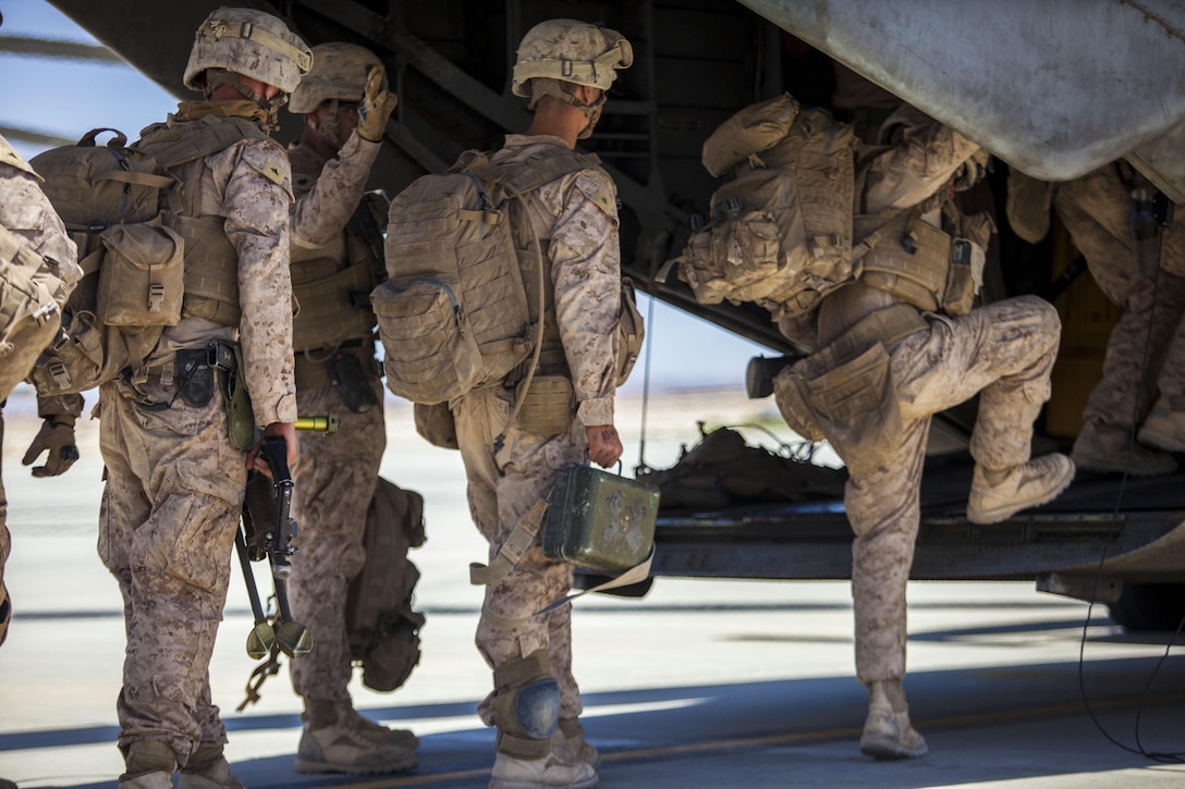 U.S. Marines assigned to Company I, Battalion Landing Team (BLT) 3/2, 26th Marine Expeditionary Unit, board an MV-22B Osprey assigned to Marine Medium Tiltrotor Squadron (VMM) 266 (Reinforced), at King Faisal Air Base in Jordan, June 14, 2013. Exercise Eager Lion 2013 is an annual, multinational exercise designed to strengthen military-to-military relationships and enhance security and stability in the region by responding to modern-day security scenarios. The 26th MEU is a Marine Air-Ground Task Force forward-deployed to the U.S. 5th Fleet area of responsibility aboard the Kearsarge Amphibious Ready Group serving as a sea-based, expeditionary crisis response force capable of conducting amphibious operations across the full range of military operations. (U.S. Marine Corps photograph by Sgt. Christopher Q. Stone, 26th MEU Combat Camera/Released)