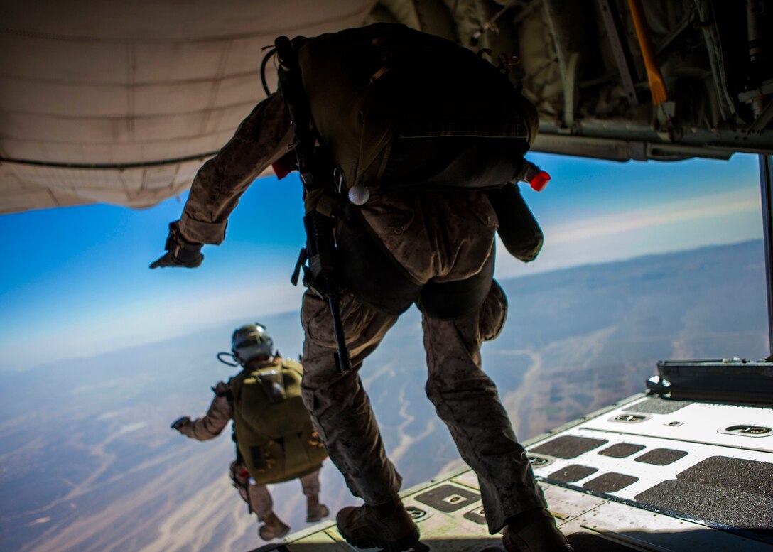 A 26th Marine Expeditionary Unit (MEU) Maritime Raid Force Marine exits a KC-130J Hercules assigned to 26th MEU command element, during high altitude, high opening parachute operations over King Faisal Air Base in Jordan, June 15, 2013. Exercise Eager Lion 2013 is an annual, multinational exercise designed to strengthen military-to-military relationships and enhance security and stability in the region by responding to realistic, modern-day security scenarios. The 26th MEU is a Marine Air-Ground Task Force forward-deployed to the U.S. 5th Fleet area of responsibility aboard the Kearsarge Amphibious Ready Group serving as a sea-based, expeditionary crisis response force capable of conducting amphibious operations across the full range of military operations. (U.S. Marine Corps photo by Sgt. Christopher Q. Stone, 26th MEU Combat Camera/Released)