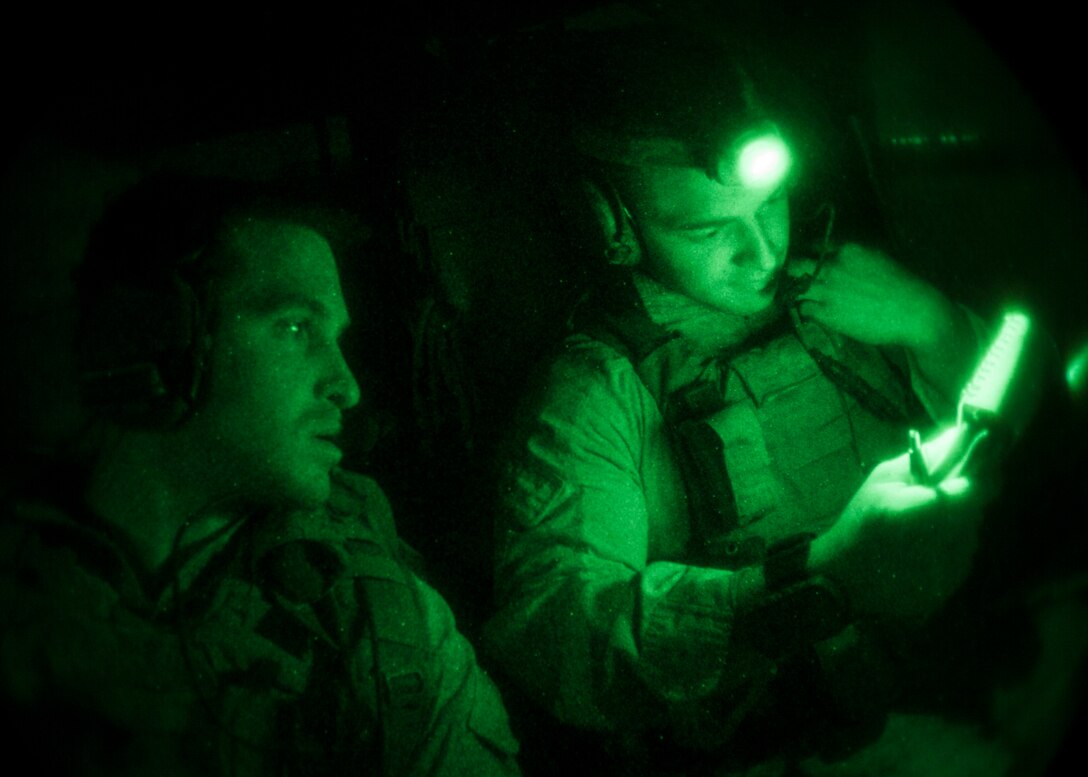 26th Marine Expeditionary Unit (MEU) Maritime Raid Force Marines call in close air support while during nighttime joint terminal attack control training with a UH-1N Huey and an AH-1W Super Cobra assigned to Marine Medium Tiltorotor Squadron (VMM) 266 (Reinforced), in Jordan, June 16, 2013. Exercise Eager Lion 2013 is an annual, multinational exercise designed to strengthen military-to-military relationships and enhance security and stability in the region by responding to realistic, modern-day security scenarios. The 26th MEU is a Marine Air-Ground Task Force forward-deployed to the U.S. 5th Fleet area of responsibility aboard the Kearsarge Amphibious Ready Group serving as a sea-based, expeditionary crisis response force capable of conducting amphibious operations across the full range of military operations. (U.S. Marine Corps photo by Sgt. Christopher Q. Stone, 26th MEU Combat Camera/Released)