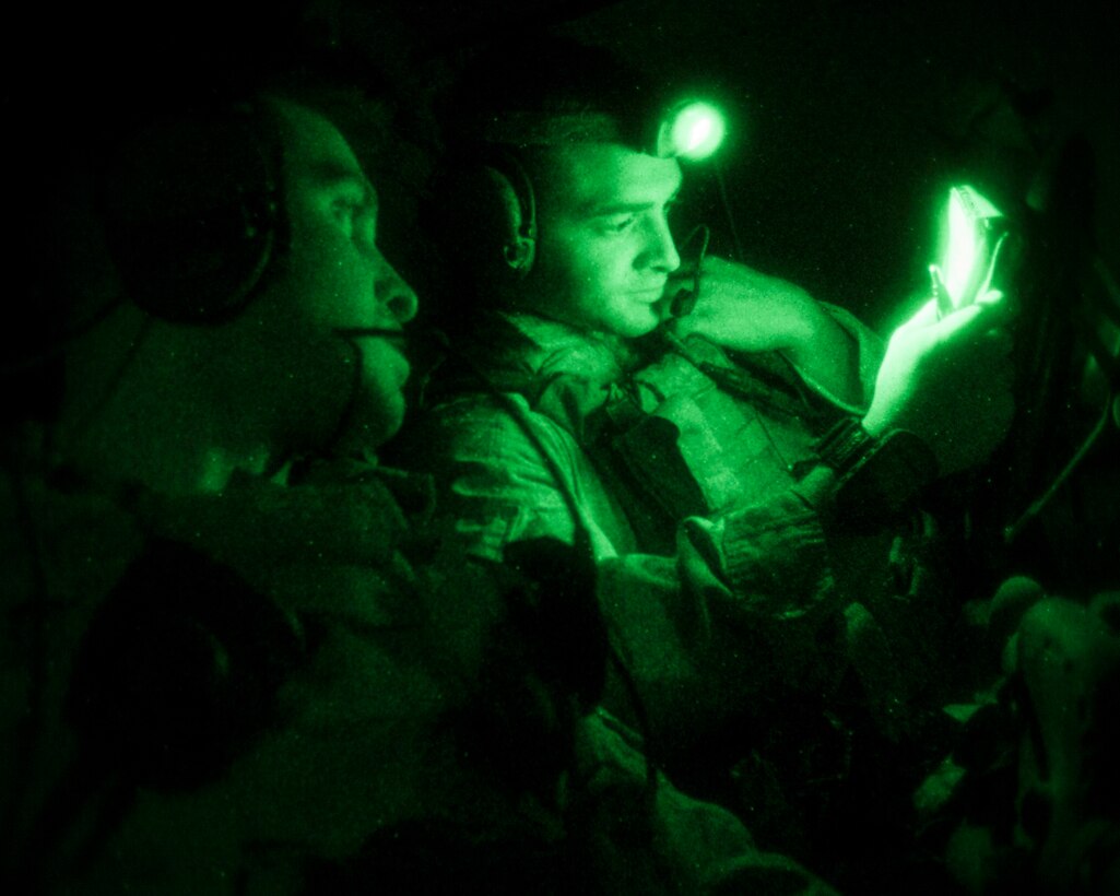 26th Marine Expeditionary Unit (MEU) Maritime Raid Force Marines call in close air support while during nighttime joint terminal attack control training with a UH-1N Huey and an AH-1W Super Cobra assigned to Marine Medium Tiltorotor Squadron (VMM) 266 (Reinforced), in Jordan, June 16, 2013. Exercise Eager Lion 2013 is an annual, multinational exercise designed to strengthen military-to-military relationships and enhance security and stability in the region by responding to realistic, modern-day security scenarios. The 26th MEU is a Marine Air-Ground Task Force forward-deployed to the U.S. 5th Fleet area of responsibility aboard the Kearsarge Amphibious Ready Group serving as a sea-based, expeditionary crisis response force capable of conducting amphibious operations across the full range of military operations. (U.S. Marine Corps photo by Sgt. Christopher Q. Stone, 26th MEU Combat Camera/Released)