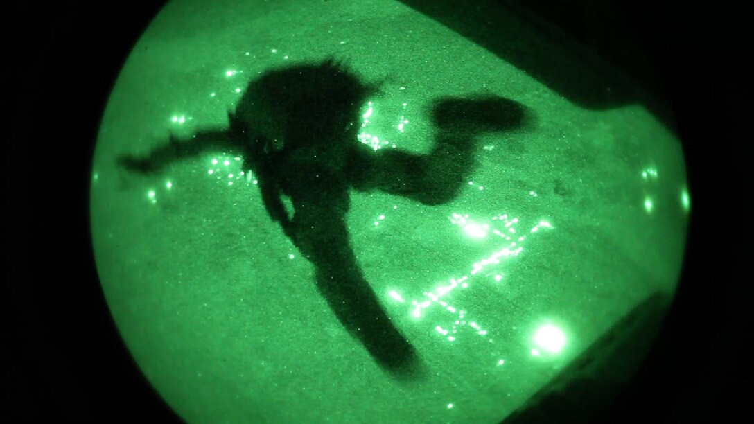 A 26th Marine Expeditionary Unit (MEU) Maritime Raid Force Marine exits a CH-53E Super Stallion assigned to Marine Medium Tiltrotor Squadron (VMM) 266 (Reinforced), during parachute operations over King Faisal Air Base in Jordan, June 17, 2013. Exercise Eager Lion 2013 is an annual, multinational exercise designed to strengthen military-to-military relationships and enhance security and stability in the region by responding to modern-day security scenarios. The 26th MEU is a Marine Air-Ground Task Force forward-deployed to the U.S. 5th Fleet area of responsibility aboard the Kearsarge Amphibious Ready Group serving as a sea-based, expeditionary crisis response force capable of conducting amphibious operations across the full range of military operations. (U.S. Marine Corps photograph by Sgt. Christopher Q. Stone, 26th MEU Combat Camera/Released)