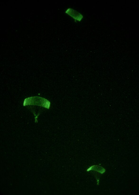 26th Marine Expeditionary Unit (MEU) Maritime Raid Force Marines descends to the ground while conducting parachute operations over King Faisal Air Base in Jordan, June 18, 2013. Exercise Eager Lion 2013 is an annual, multinational exercise designed to strengthen military-to-military relationships and enhance security and stability in the region by responding to realistic, modern-day security scenarios. The 26th MEU is a Marine Air-Ground Task Force forward-deployed to the U.S. 5th Fleet area of responsibility aboard the Kearsarge Amphibious Ready Group serving as a sea-based, expeditionary crisis response force capable of conducting amphibious operations across the full range of military operations. (U.S. Marine Corps photo by Sgt. Christopher Q. Stone, 26th MEU Combat Camera/Released)