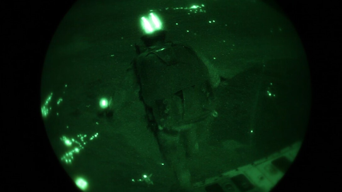 A 26th Marine Expeditionary Unit (MEU) Maritime Raid Force Marine exits a C-130J Hercules assigned to 26th MEU command element, while conducting parachute operations over King Faisal Air Base in Jordan, June 18, 2013. Exercise Eager Lion 2013 is an annual, multinational exercise designed to strengthen military-to-military relationships and enhance security and stability in the region by responding to realistic, modern-day security scenarios. The 26th MEU is a Marine Air-Ground Task Force forward-deployed to the U.S. 5th Fleet area of responsibility aboard the Kearsarge Amphibious Ready Group serving as a sea-based, expeditionary crisis response force capable of conducting amphibious operations across the full range of military operations. (U.S. Marine Corps photo by Sgt. Christopher Q. Stone, 26th MEU Combat Camera/Released)