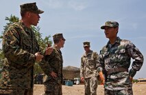 U.S. Marine Sgt. Robert W. Walker, left, explains the capabilities of the miniature deployable assistance water purification system to People’s Liberation Army Capt. Wang Weijin at a disaster site in Biang, Brunei Darussalam, June 19 as part of the Association of Southeast Asian Nations Humanitarian Assistance/Disaster Relief and Military Medicine Exercise (AHMX). Engineers with China, Singapore and the U.S. demonstrated their water purification capabilities to senior leaders at the disaster site. Walker is a engineer equipment electrical systems technician with 9th Engineer Support Battalion, 3rd Marine Logistics Group, III Marine Expeditionary Force. Weijin is a Chinese engineer.


