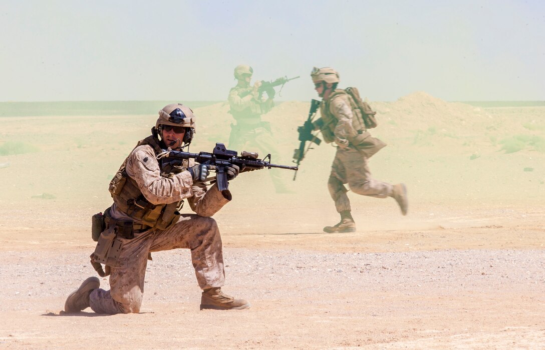 26th Marine Expeditionary Unit (MEU) Maritime Raid Force Marines bound back during an immediate action drill at a range in Jordan, June 19, 2013. Exercise Eager Lion 2013 is an annual, multinational exercise designed to strengthen military-to-military relationships and enhance security and stability in the region by responding to modern-day security scenarios. The 26th MEU is a Marine Air-Ground Task Force forward-deployed to the U.S. 5th Fleet area of responsibility aboard the Kearsarge Amphibious Ready Group serving as a sea-based, expeditionary crisis response force capable of conducting amphibious operations across the full range of military operations. (U.S. Marine Corps photograph by Sgt. Christopher Q. Stone, 26th MEU Combat Camera/Released)