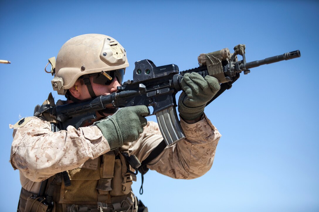 A 26th Marine Expeditionary Unit (MEU) Maritime Raid Force Marine engages simulated hostile targest during an immediate action drill at a range in Jordan, June 19, 2013. Exercise Eager Lion 2013 is an annual, multinational exercise designed to strengthen military-to-military relationships and enhance security and stability in the region by responding to modern-day security scenarios. The 26th MEU is a Marine Air-Ground Task Force forward-deployed to the U.S. 5th Fleet area of responsibility aboard the Kearsarge Amphibious Ready Group serving as a sea-based, expeditionary crisis response force capable of conducting amphibious operations across the full range of military operations. (U.S. Marine Corps photograph by Sgt. Christopher Q. Stone, 26th MEU Combat Camera/Released)