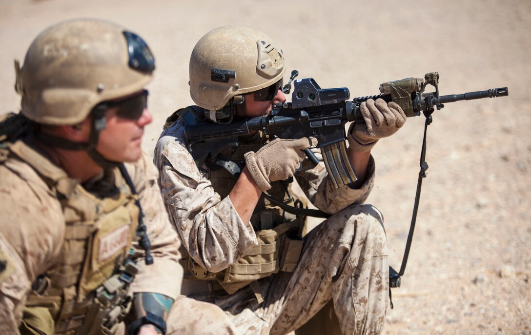U.S. Marine Lance Cpl. Christopher Squire, a native of Unionville, Va., 26th Marine Expeditionary Unit (MEU) C-130J Hercules loadmaster, engages simulated hostile targets during an immediate action drill at a range in Jordan, June 19, 2013. Exercise Eager Lion 2013 is an annual, multinational exercise designed to strengthen military-to-military relationships and enhance security and stability in the region by responding to modern-day security scenarios. The 26th MEU is a Marine Air-Ground Task Force forward-deployed to the U.S. 5th Fleet area of responsibility aboard the Kearsarge Amphibious Ready Group serving as a sea-based, expeditionary crisis response force capable of conducting amphibious operations across the full range of military operations. (U.S. Marine Corps photograph by Sgt. Christopher Q. Stone, 26th MEU Combat Camera/Released)