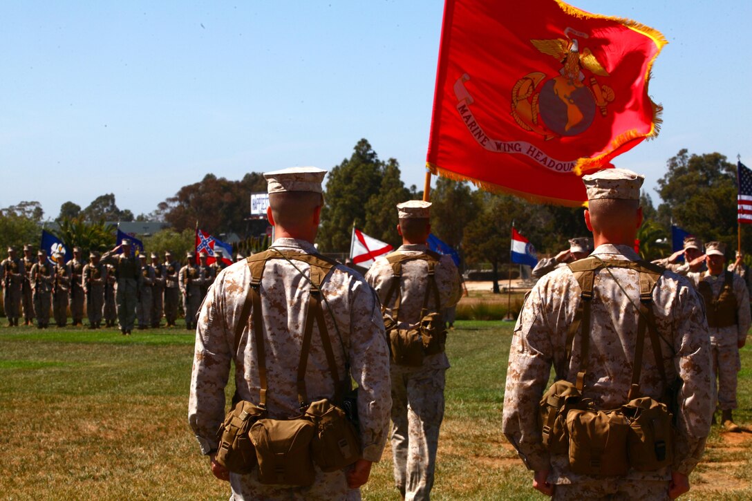 Lt. Col. Michael Tyson, right, the out-going commanding officer for Marine Wing Headquarters Squadron 3 and a Lancaster, Pa., native, waits for the guidon to post with Lt. Col. Shawn Budd, left, the on-coming commanding officer and a Seattle native, during a change of command ceremony aboard Marine Corps Air Station Miramar, Calif., June 21. Tyson relinquished command to Budd, before he goes to the U.S. Naval War College in Newport, R.I.