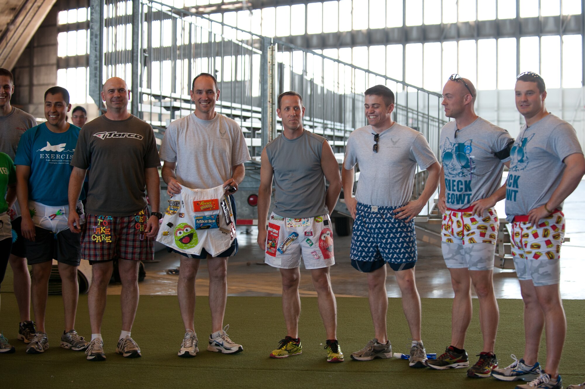 A group of Airmen gather before the beginning of the “Bling Your Briefs” 10k at Ellsworth Air Force Base, S.D., June 20, 2013. More than 35 Airmen and family members designed creative briefs to wear during 5k and 10k races to show their support for Men’s Health Month. (U.S. Air Force photo by Airman 1st Class Alystria Maurer/Released)