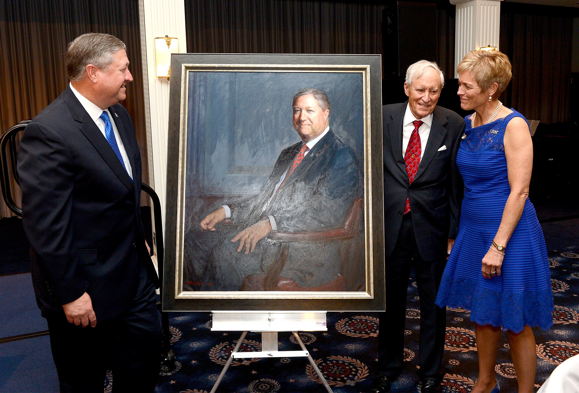 Secretary of the Air Force Michael Donley and his wife, Gail, look at Donley's official portrait during an unveiling with the artist, Peter Egeli, during the farewell dinner in honor of the Donleys at Joint Base Anacostia-Bolling, D.C., June 20, 2013.  (U.S. Air Force photo/Scott M. Ash)