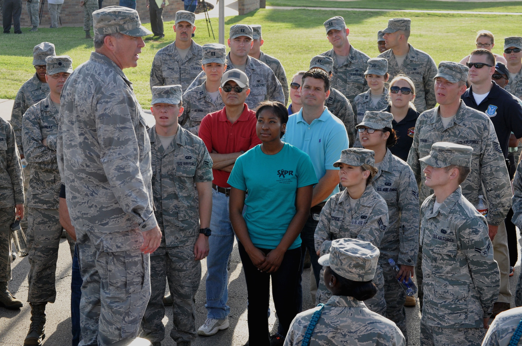 Members of the wing staff listen attentively to Brig. Gen. Michael Fantini as he speaks out against sexual assault during Operation REAL (Respect, Equality, Accountability, and Leadership). The event declared a base-wide stand down as a way to bring awareness to sexual assault.. (U.S. Air Force photo by Kimberly Goff)