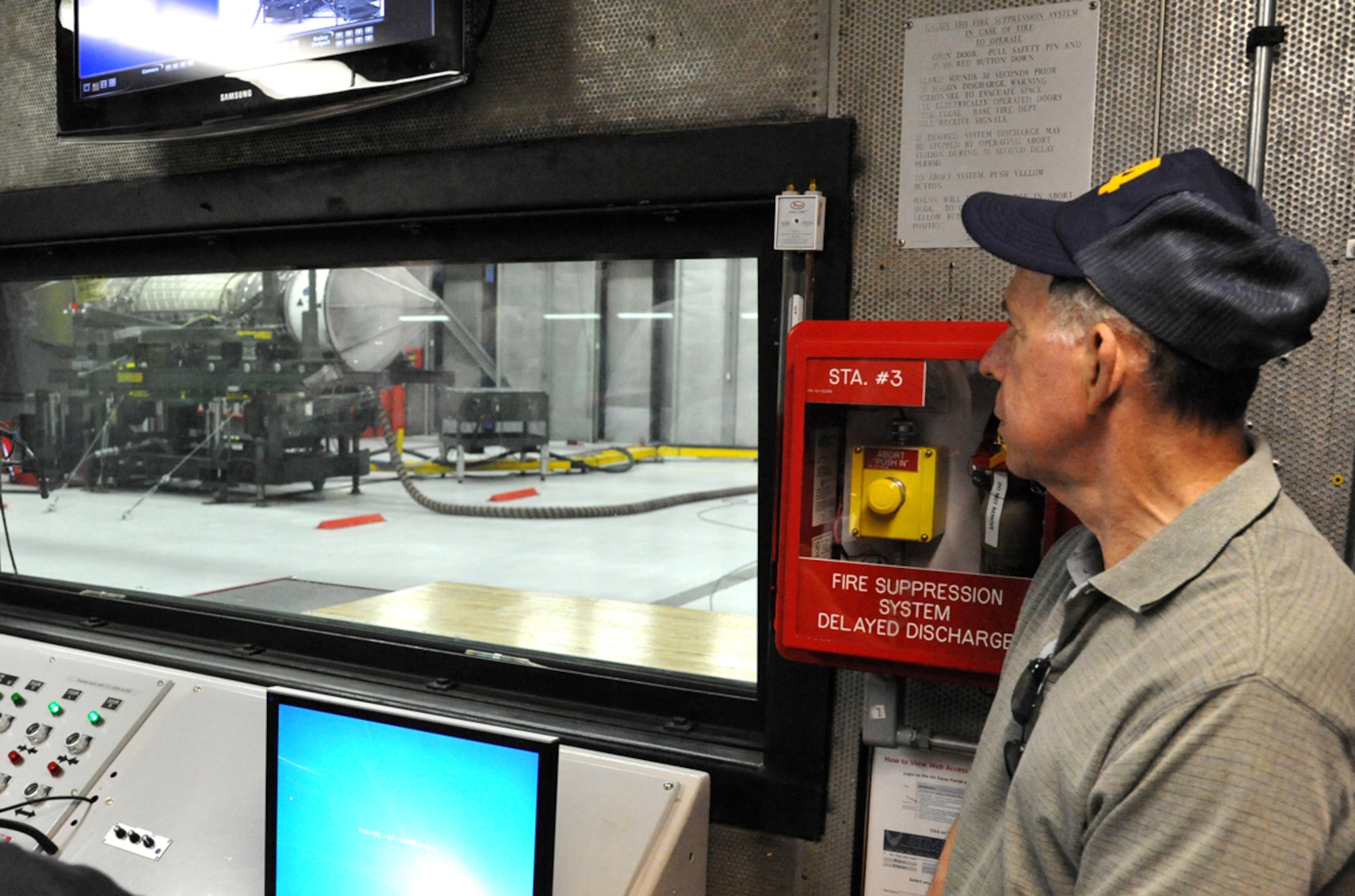 JOINT BASE ELMENDORF-RICHARDSON, Alaska – Retired Air Force Lt. Col. Al Vazquez, former fighter pilot with the 43rd Tactical Fighter Squadron, watches an F-22 Raptor engine in action at the Joint Base Elmendorf-Richardson hush house June 14 during a tour of the base. Members of the 43rd TFS reunited on JBER, along with some of their family members, to commemorate the 43rd anniversary of the squadron being activated here. (U.S. Air Force photo/Senior Airman Blake Mize)