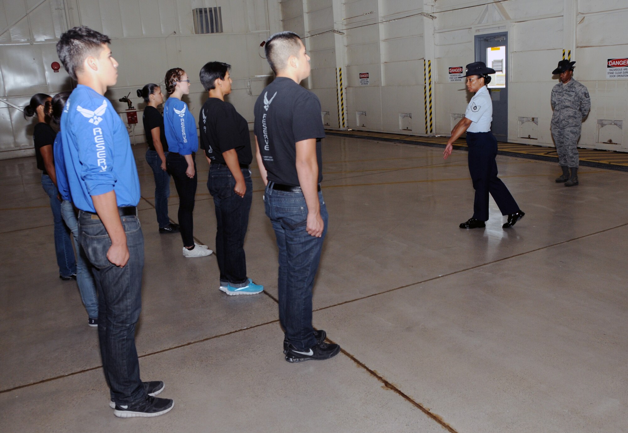 Tech. Sgt. Tammanica Rogers, 433rd Training Readiness Squadron Reserve Training instructor, visiting from Lackland Air Force Base, gives advice on how to excel during basic military training to new recruits from the 944th Fighter Wing. (U.S. Air Force photo/Tech. Sgt. Louis Vega Jr.) 