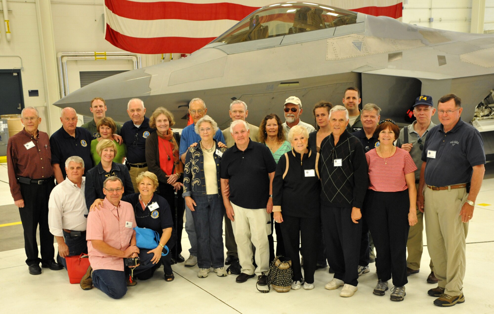 JOINT BASE ELMENDORF-RICHARDSON, Alaska - Members of the 43rd Tactical Fighter Squadron, which was based at what was then Elmendorf Air Force Base from 1970 until 1994, and their family members pose in front of an F-22 Raptor at Joint Base Elmendorf-Richardson's 525th Fighter Squadron June 14 during a tour of the base. Members of the 43rd TFS reunited on Joint Base Elmendorf-Richardson, along with some of their family members, to commemorate the 43rd anniversary of the squadron being activated here. (U.S. Air Force photo/Senior Airman Blake Mize)
