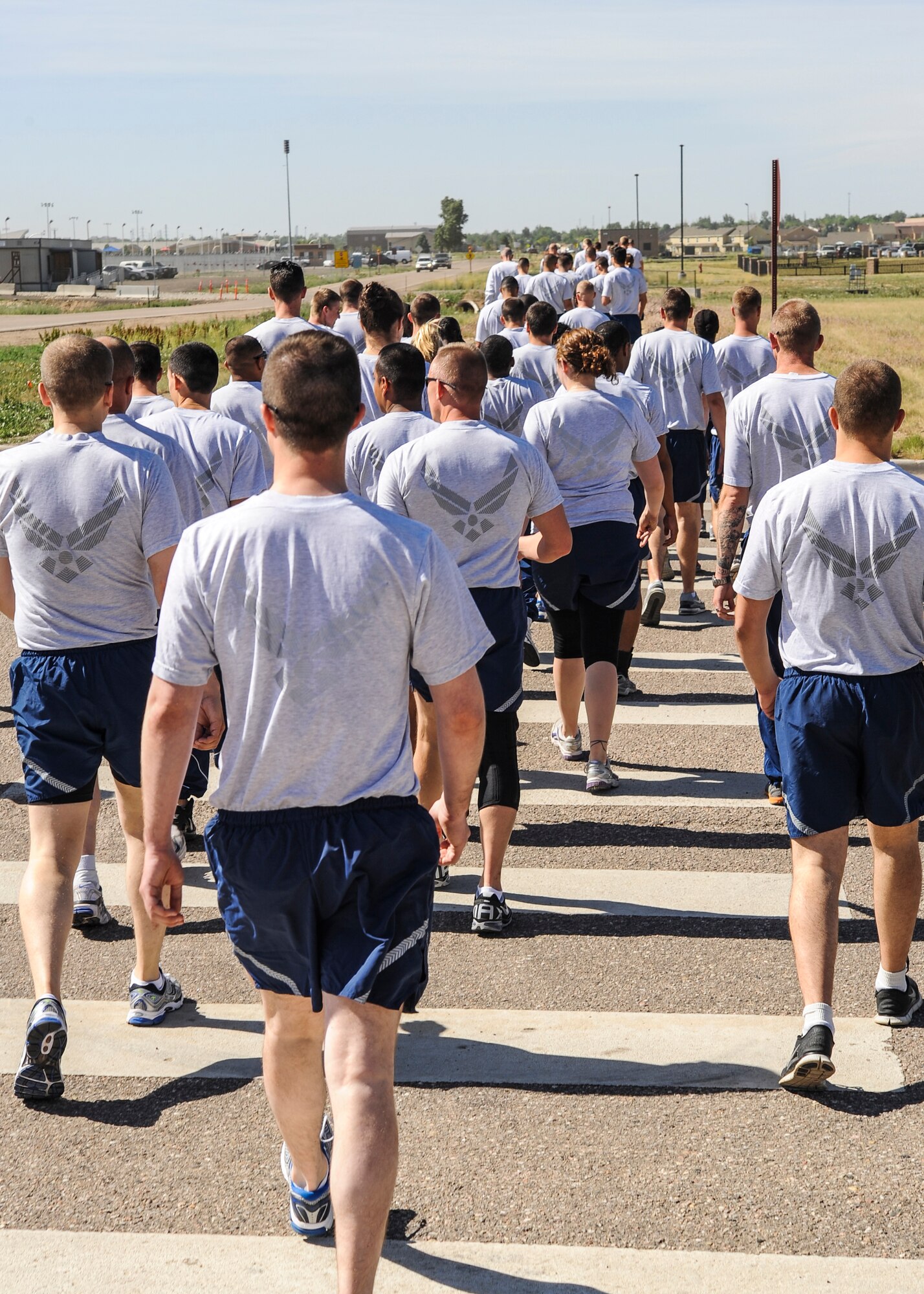 Team Buckley members walk during a walk and talk June 20, 2013, on Buckley Air Force Base, Colo. Members of the 460th Space Wing took part in a Sexual Assault Prevention and Response stand-down day which focused on raising awareness and prevention measures for the increasing sexual assault problems facing the military today.  (U.S. Air Force photo by Staff Sgt. Christopher Gross/Released)