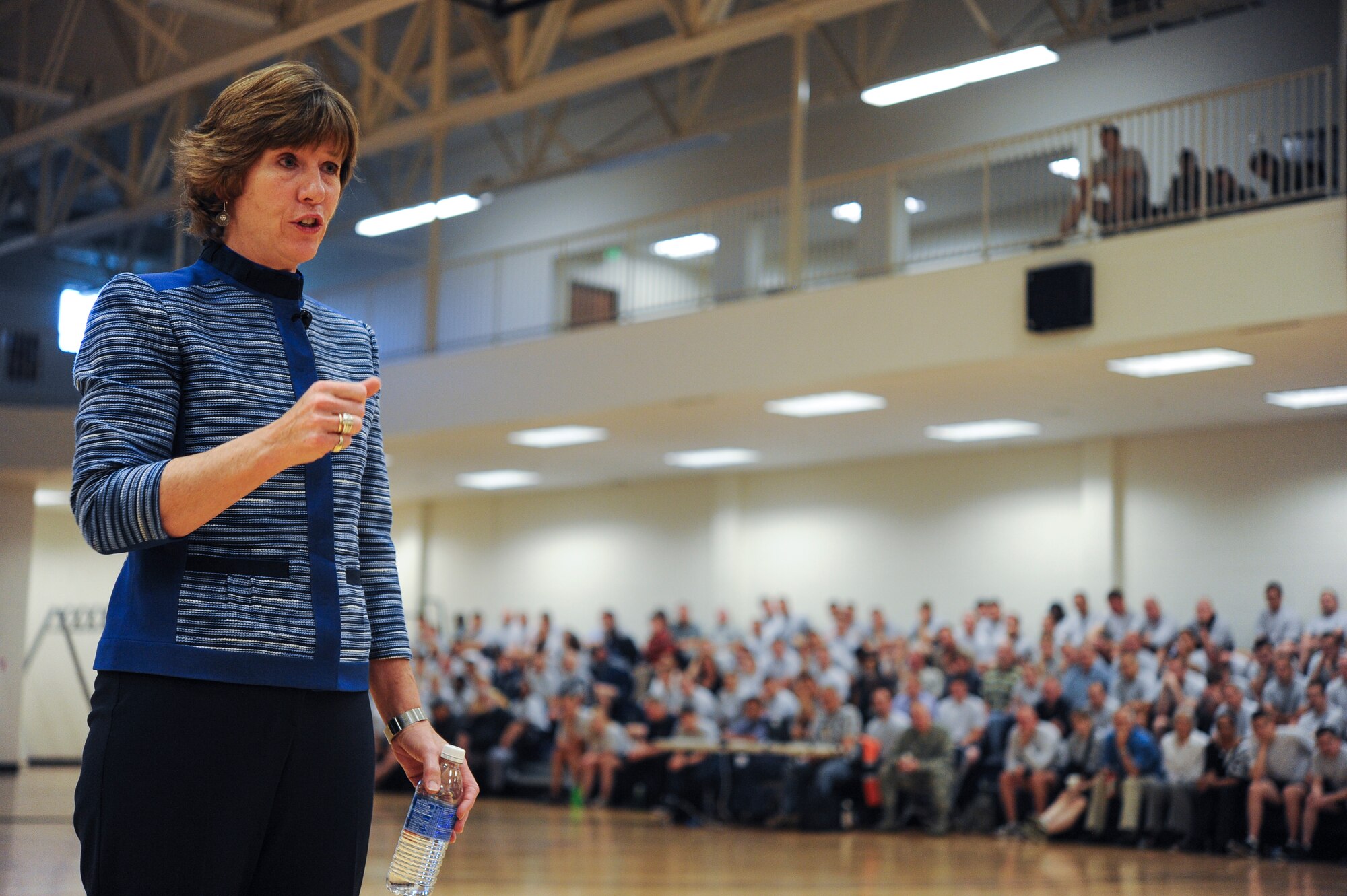 Anne Munch, a consultant and an advocate for victims of domestic violence, sexual assault and stalking, briefs Team Buckley members about a case that challenged individuals' outlooks on sexual assault cases June 20, 2013, at the fitness center on Buckley Air Force Base, Colo.  Munch is a former prosecutor and attorney with more than 25 years of experience on cases dealing with domestic violence, sexual assault and stalking. (U.S. Air Force photo by Staff Sgt. Paul Labbe/Released)