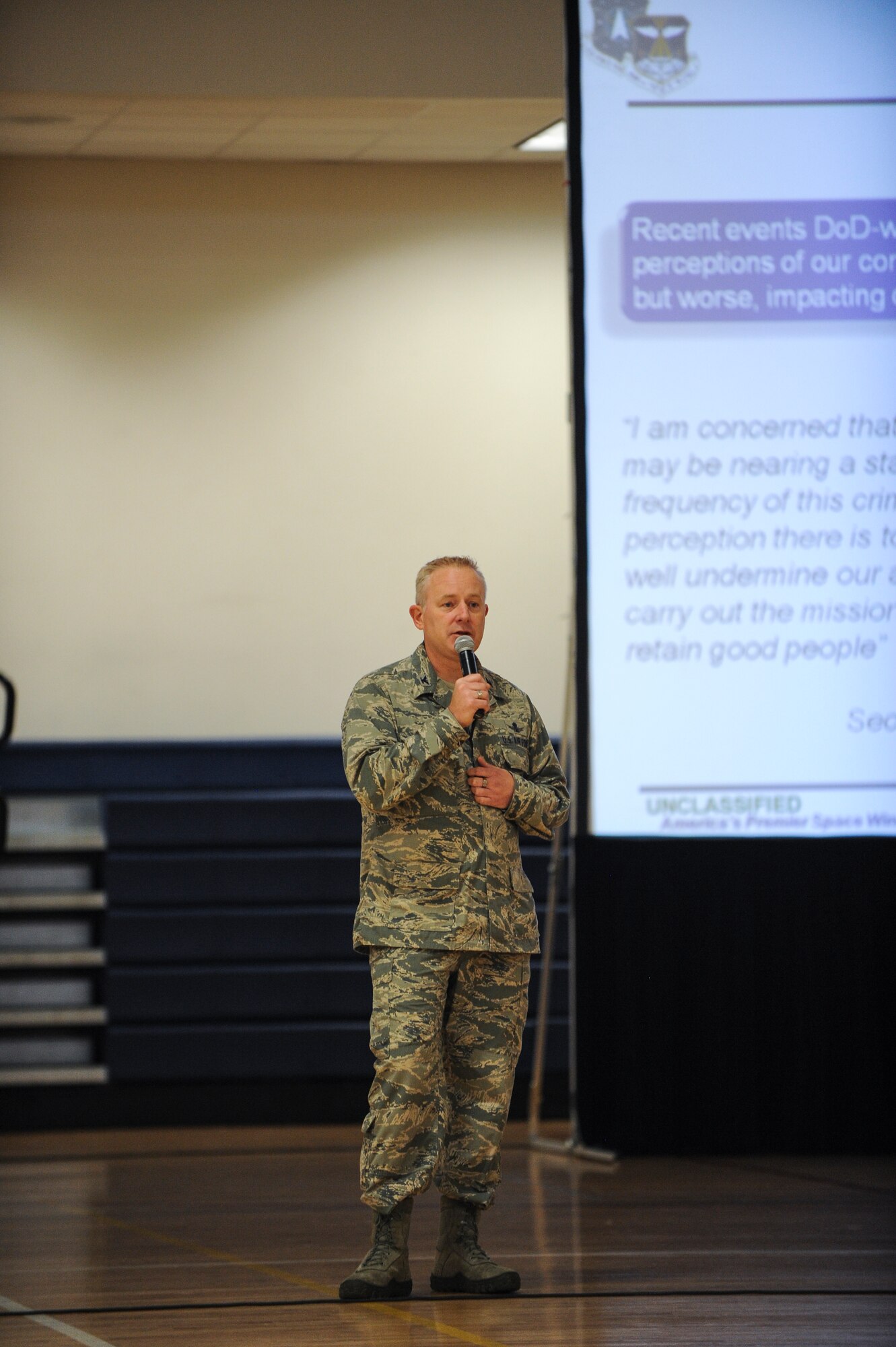 Col. Dan Dant, 460th Space Wing commander, gives opening remarks during a 460th Space Wing commander’s call during the Sexual Assault Prevention and Response Stand-down Day June 20, 2013, at the fitness center on Buckley Air Force Base, Colo. The down day gave military members an opportunity to spend the day talking and understanding how sexual assault affects the military. (U.S. Air Force photo by Staff Sgt. Paul Labbe/Released)