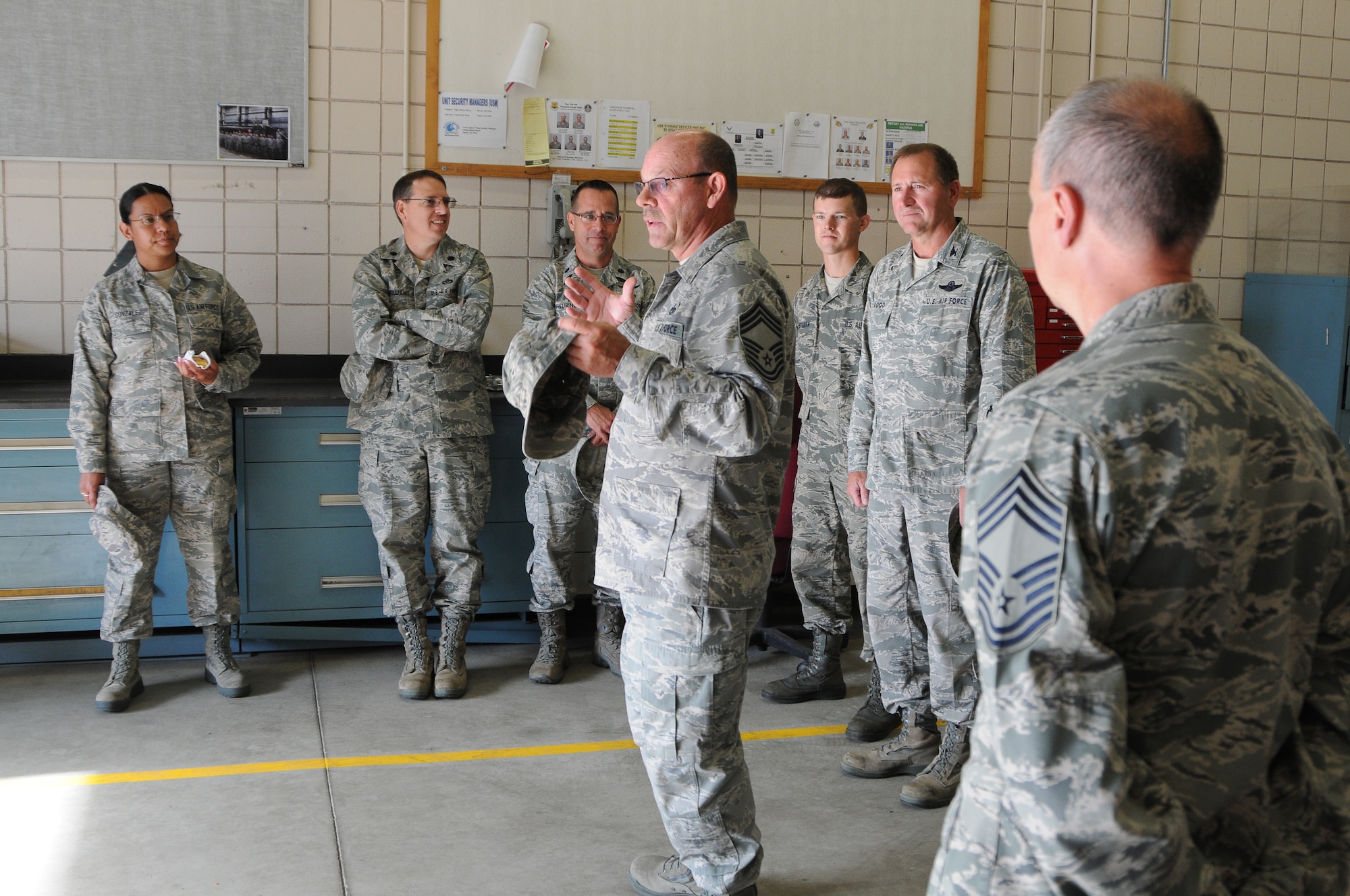 Chief Master Sgt. Allen Crist, Chief of Vehicle Maintenance, explains how Vehicle Maintenance has dramatically extended the life of vehicles from 15 years to nearly 20 with advances in maintenance and care at the 124th Fighter Wing Logistics Readiness Squadron open house at Gowen Field July 13. (Air National Guard photo by Tech. Sgt. Sarah Pokorney)